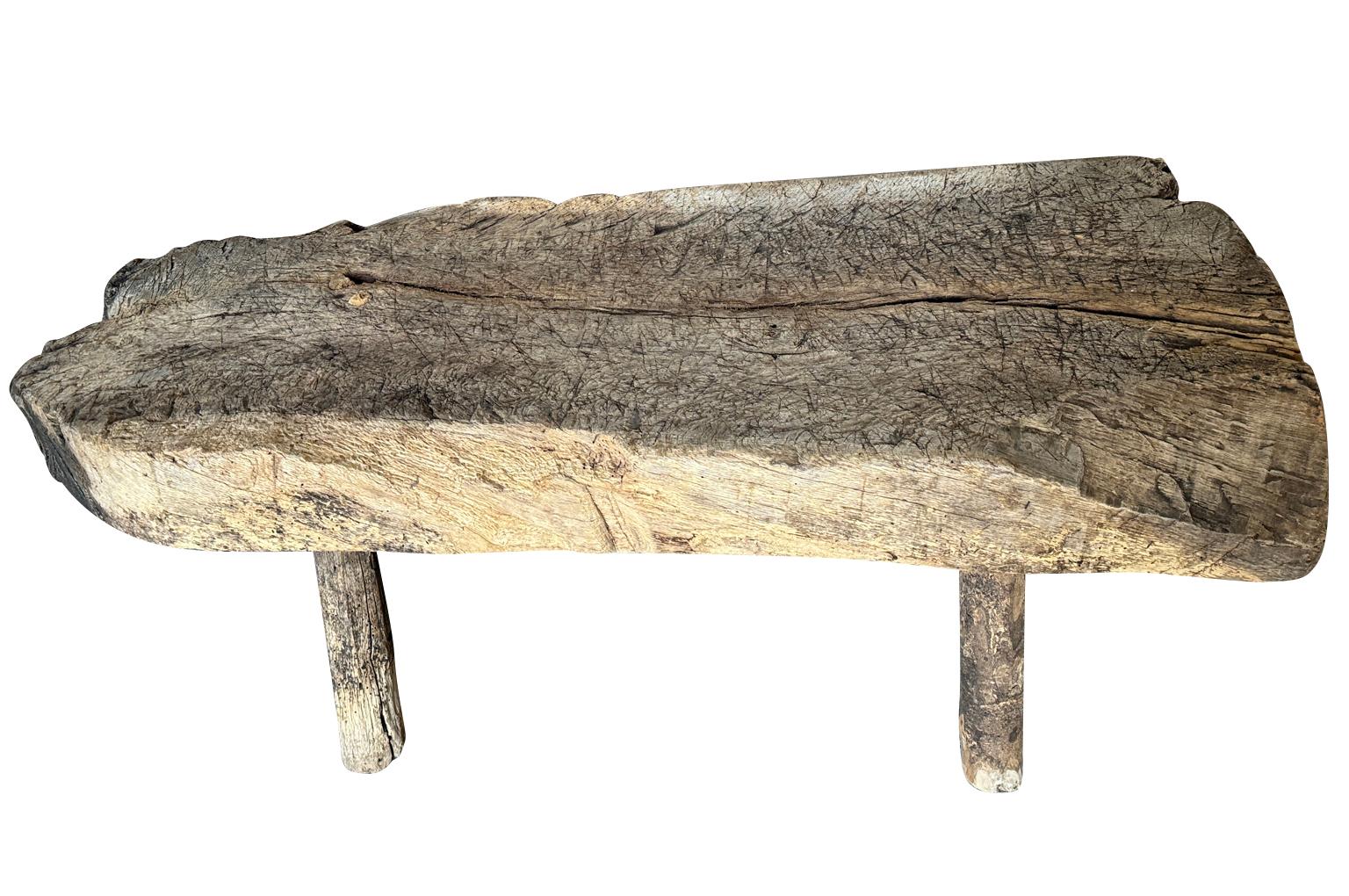 A very charming mid-18th century Primitive Bench from the Catalan region of Spain.  Wonderfully constructed from chestnut with a very thick top and fabulous patina.  Very heavy and sturdy.  Perfect at the base of a bed or as a narrow coffee table.