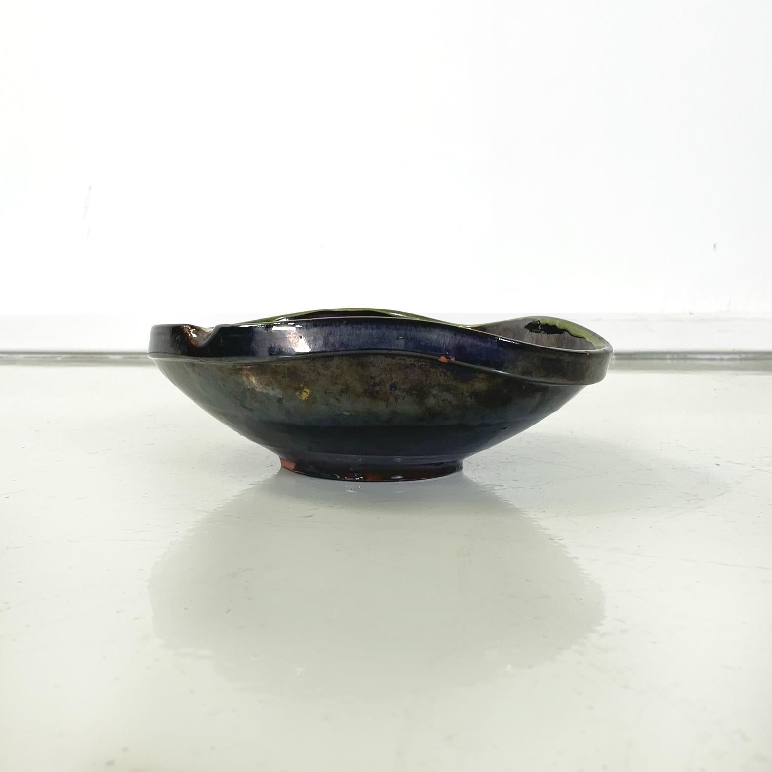 Spanish Mid-Century Modern Bowl in green, black and blue ceramic by Ignacio Buxo, 1950s
Round base bowl in green, black and blue ceramic. The upper profile is irregular. This is perfect as a centerpiece on a table or object holder.
Created by