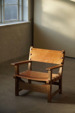 Spanischer brutalistischer Mid-Century-Modern-Sessel aus Eiche und cognacfarbenem Leder, 1960er Jahre