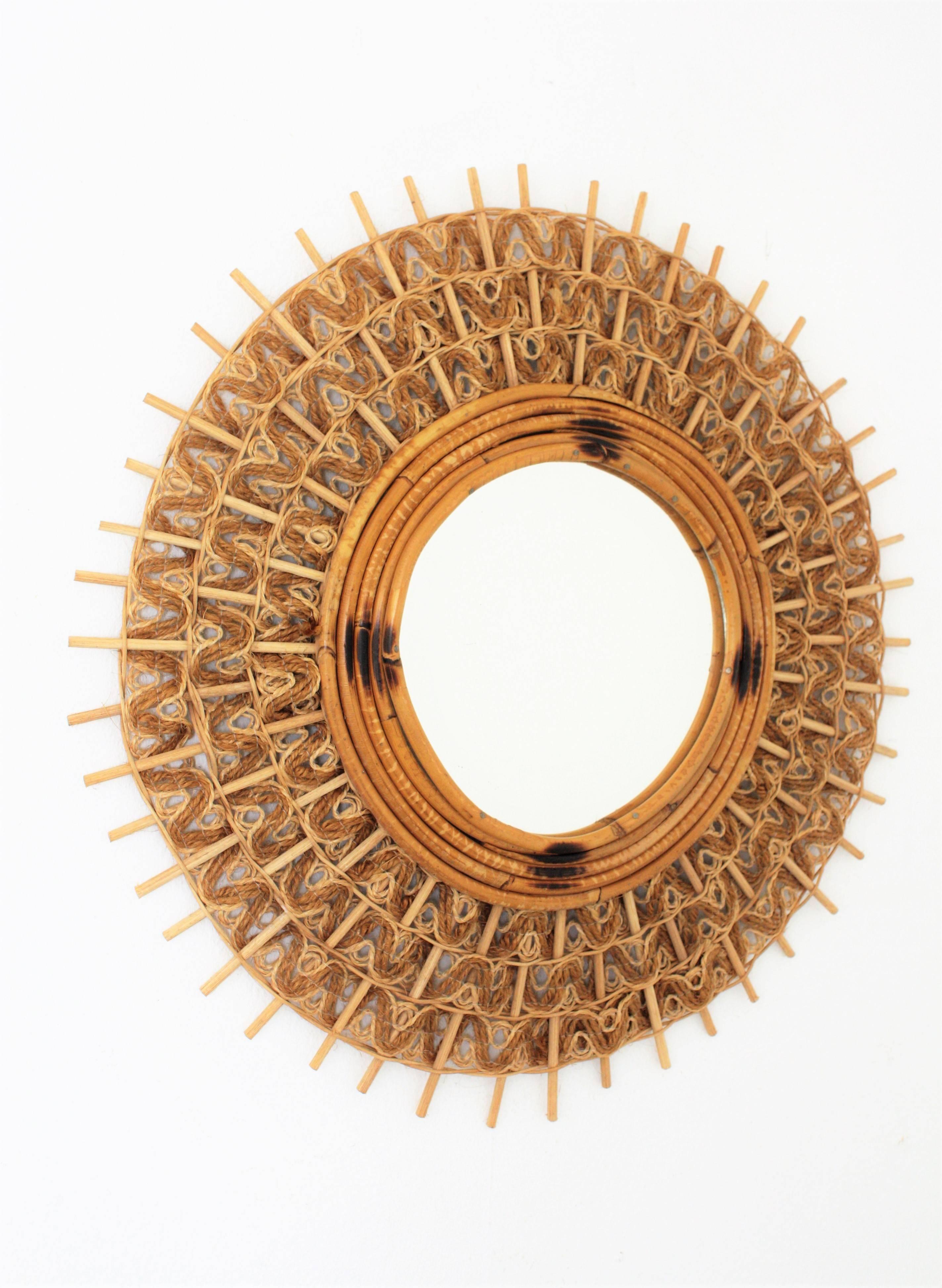 Unusual handcrafted two tones woven jute and rattan/ wicker circular sunburst mirror. The jute rope braided design combining two tones makes this piece highly decorative. Beautiful to place alone or combined with other mirrors in the manner creating
