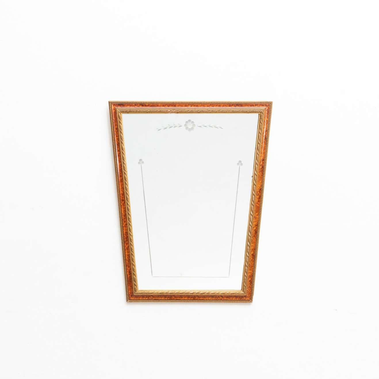 Handcrafted mid-century wood mirror made in Spain, circa 1950.
Manufactured in wood.

In original condition, with minor wear consistent of age and use, preserving a beautiful patina.