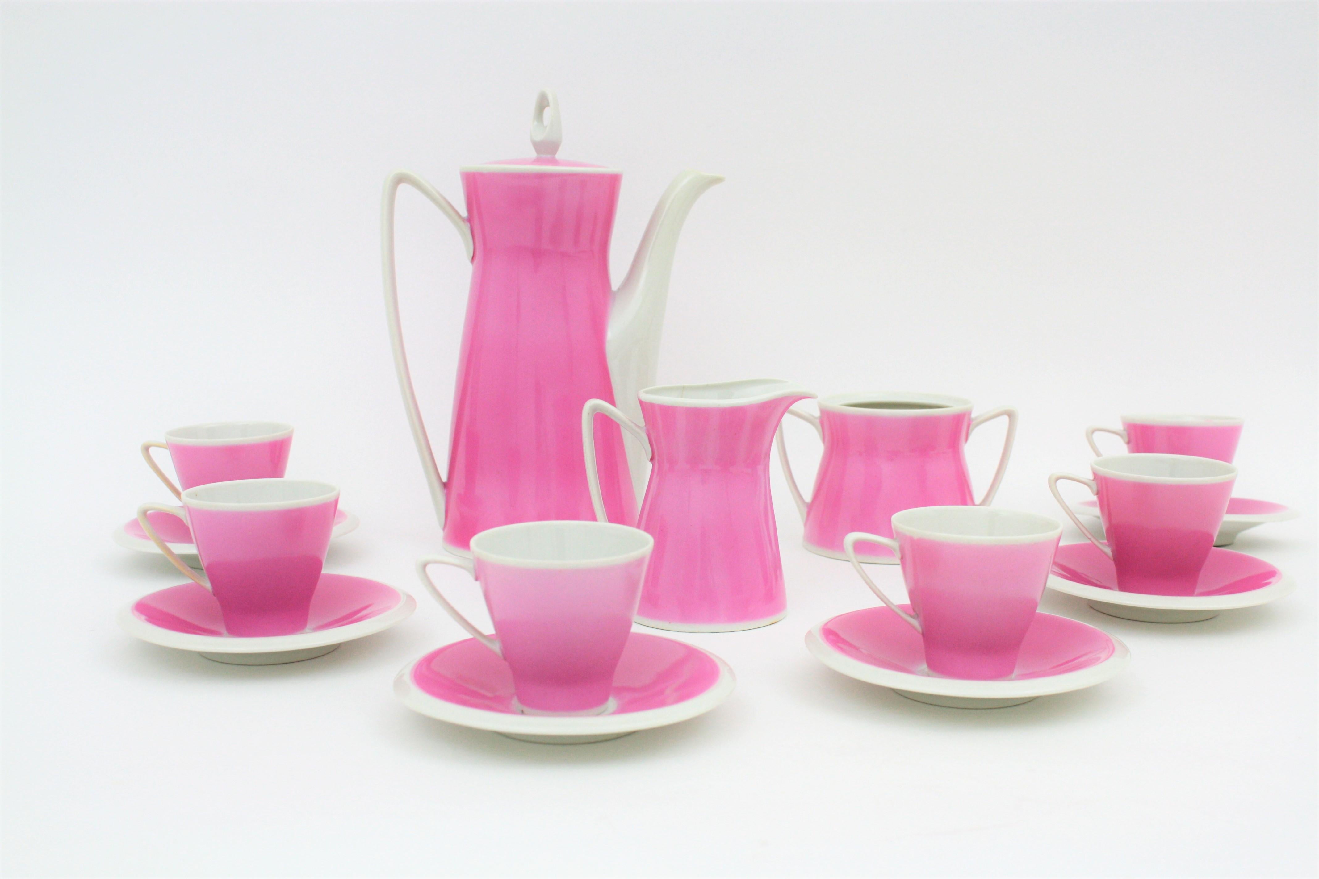 A highly decorative coffee or tea set for six persons in pink and white porcelain by Santa Clara. The set is composed by 15 pieces: Six cups, six plates, a coffee pot, a sugar container and a cream jug. Santa Clara was a Spanish porcelain and