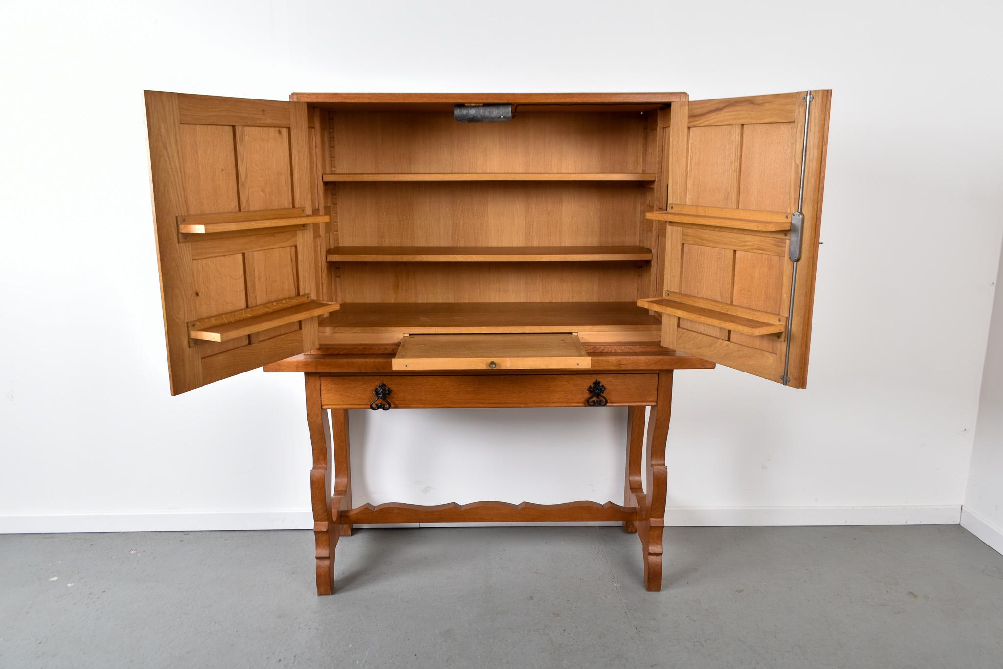 Carved Spanish mid century oak bar cabinet For Sale