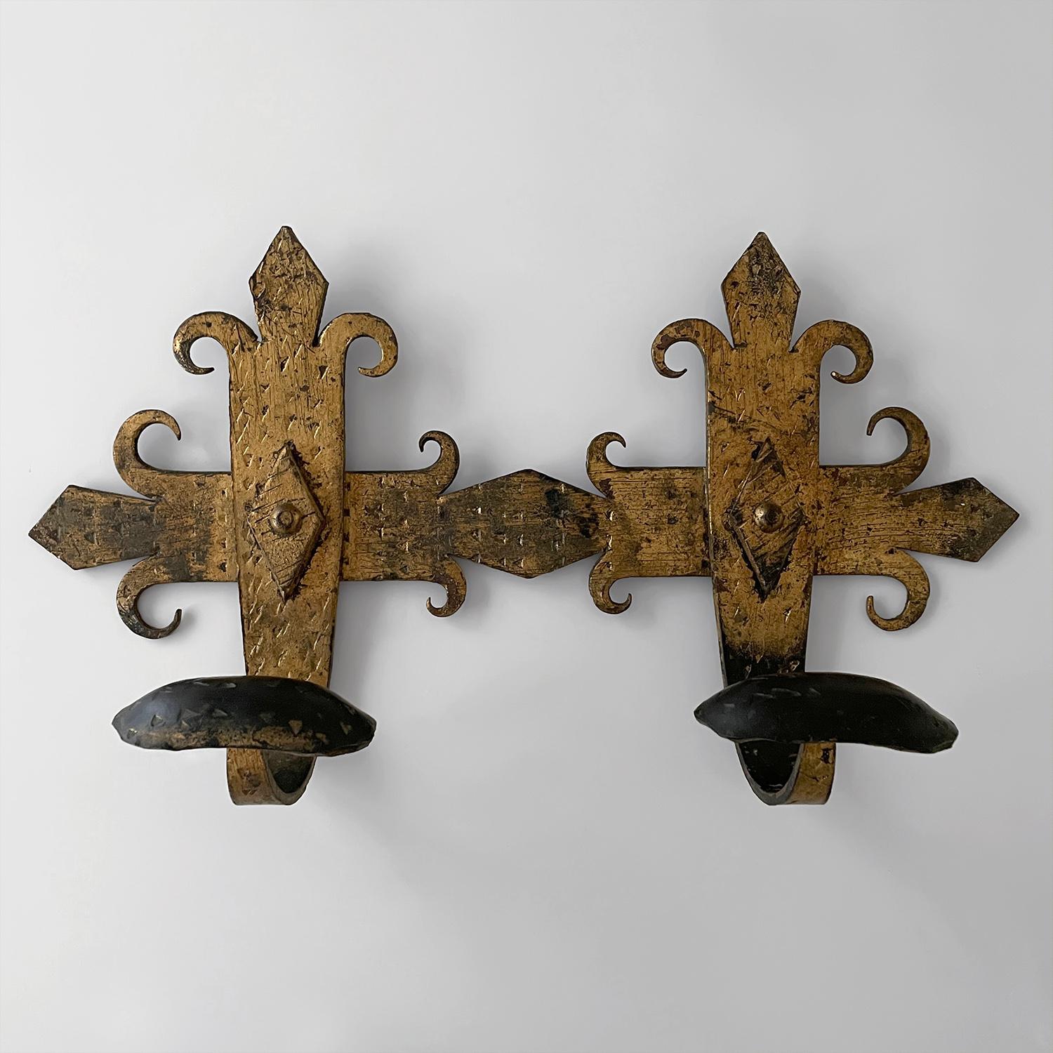 Spanish wrought iron brutalist coat rack
Barcelona, Spain, mid century 
Handcrafted artisanal piece
Heavy in weight and substantial in its construction and composition
Fleur de lis with patinaed gold detailing beautifully contrasts against the dark
