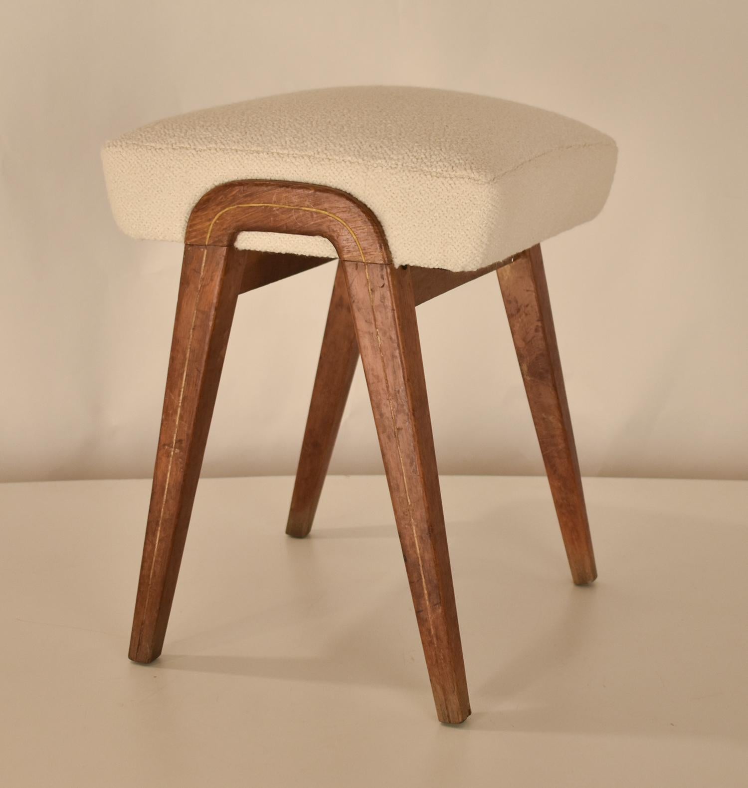 Mid-20th Century Spanish midcentury stool in oak wood and white textile.1960's