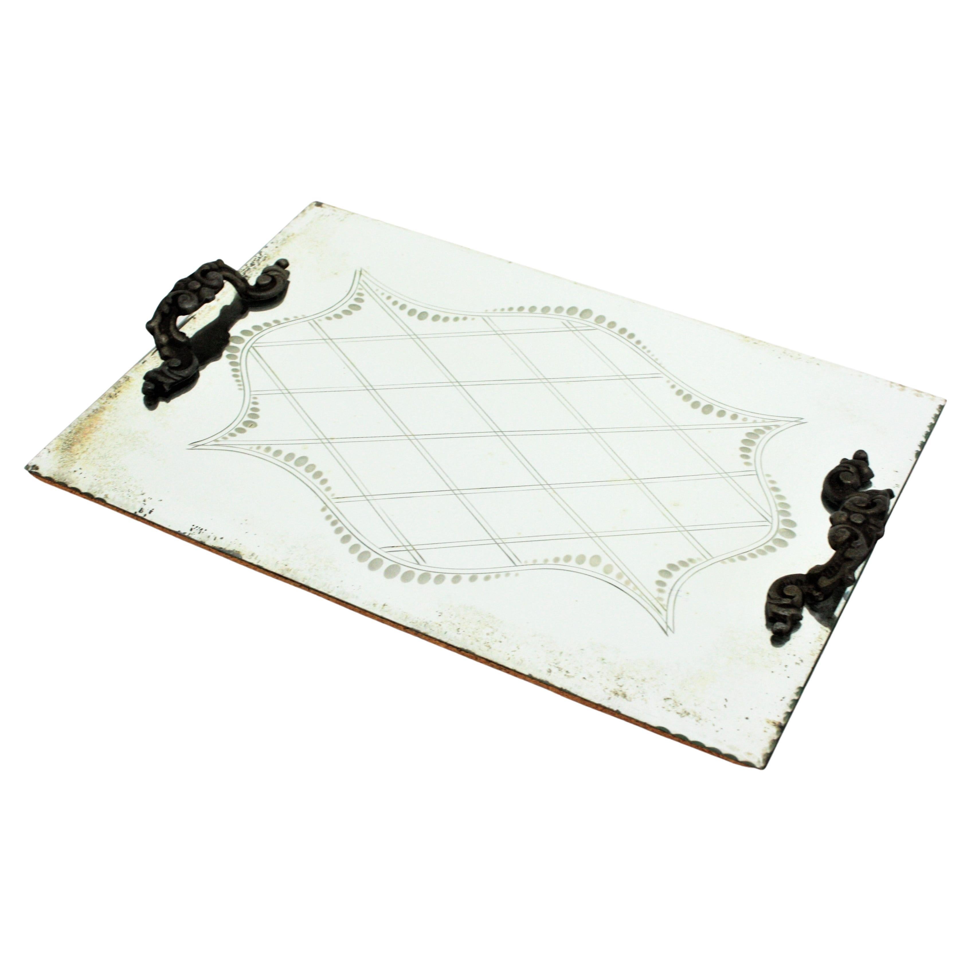 Art Deco mirror tray or vanity tray with engraved geometric motifs and metal handles, Spain, 1930s
The tray has a mirror surface with grid and dots motifs, naturalistic details decorating the handles . It shows a terrific aged patina.
Use it as