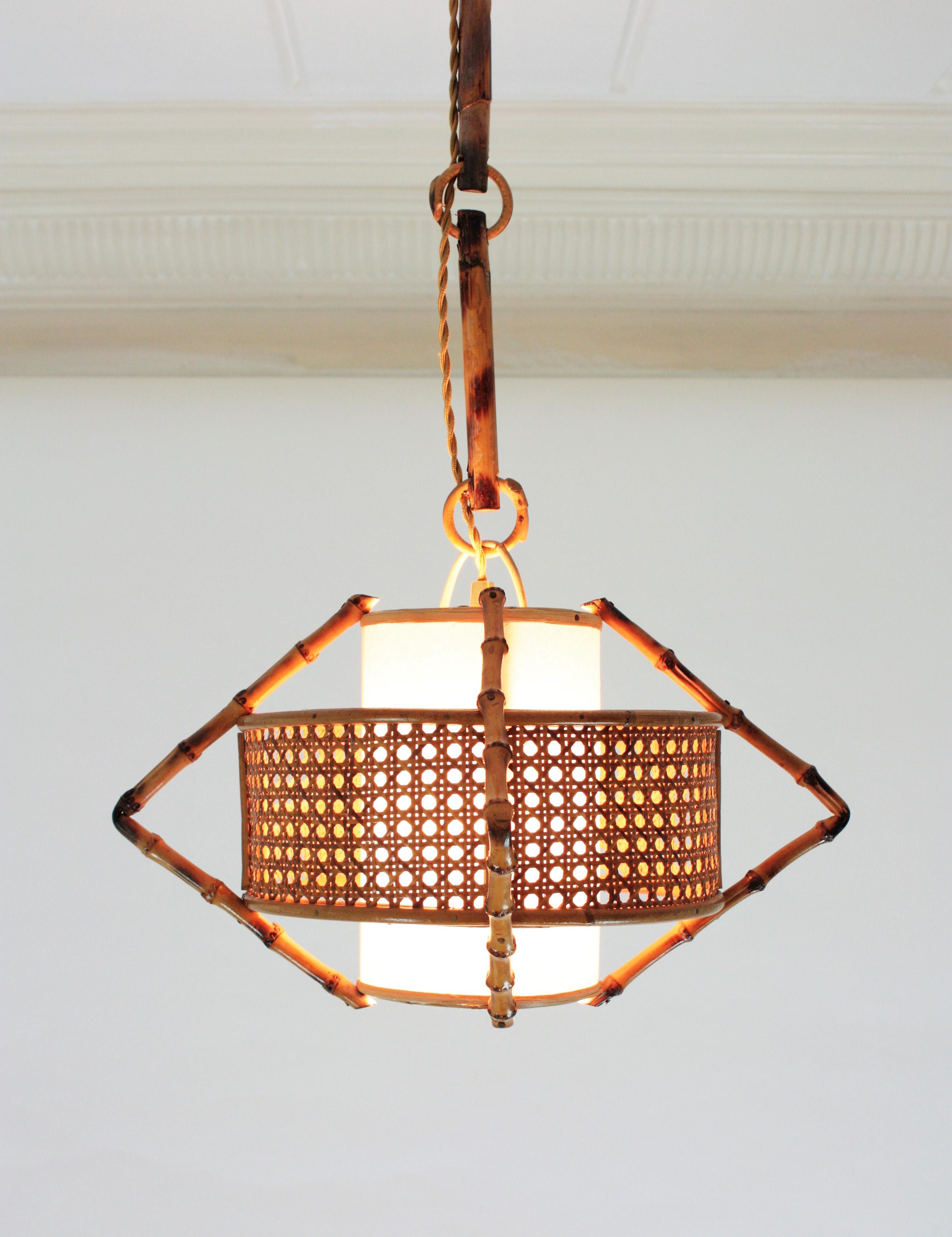Hand-Crafted Spanish Modernist Bamboo Rattan and Wicker Pendant Lamp with Tiki Accents, 1950s