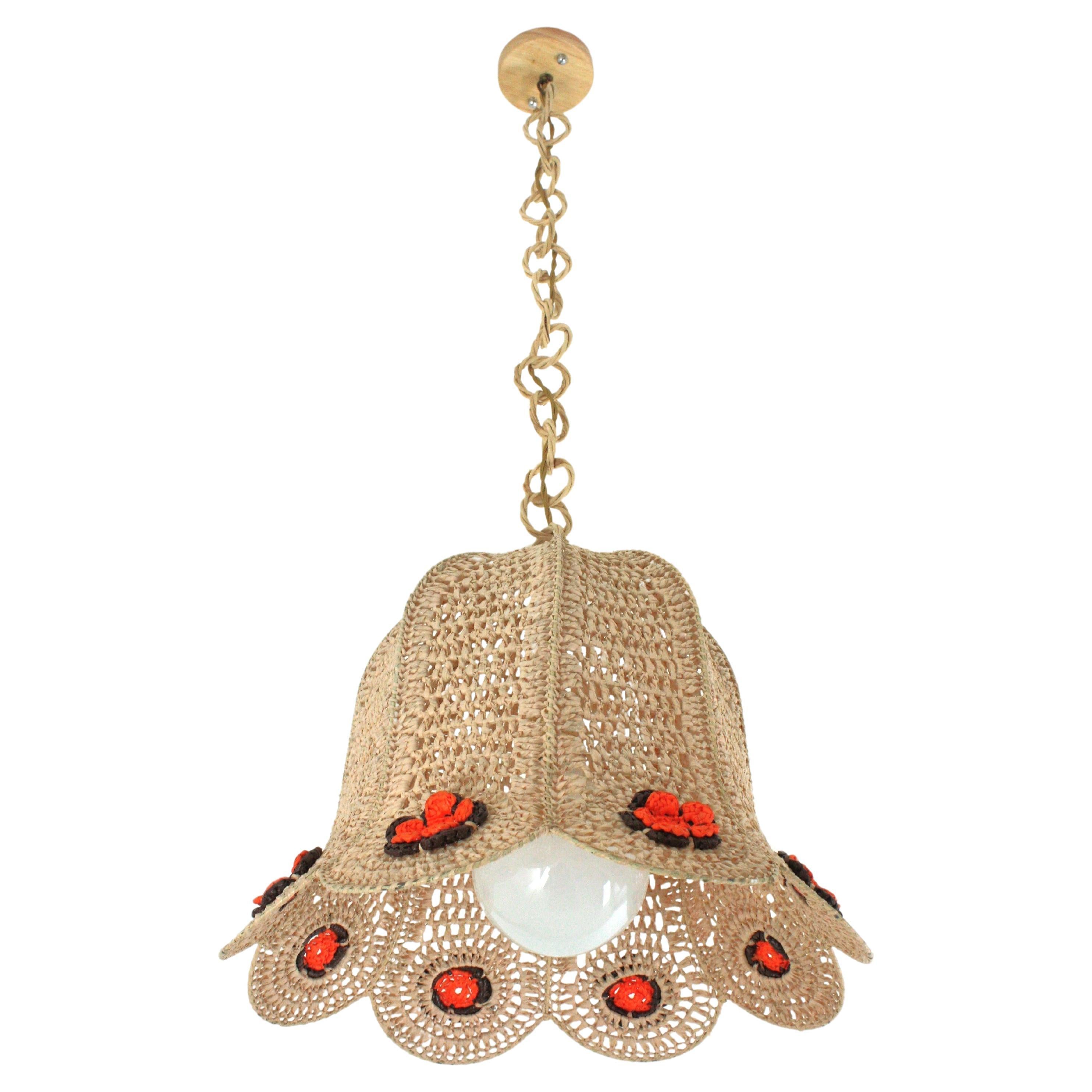 Scallop Bell Shaped Pendant Light in Acrylic Macrame and Rattan.
A funny Bohemian hand knotted macramé suspension lamp with colorful flowers accenting the bottom. Spain, 1960s-1970s.
This handcrafted chandelier features a lampshade made of hand