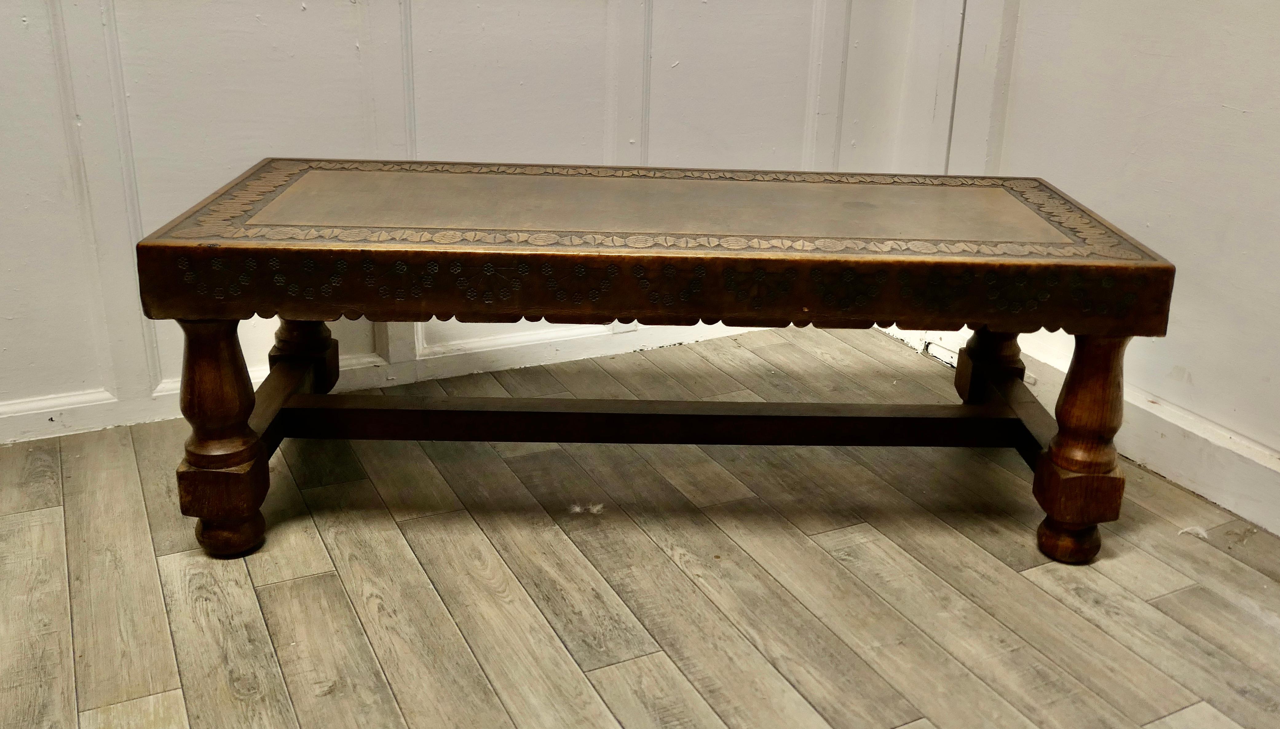 Spanish Oak and Leather Farmhouse Coffee Table

This is a traditional Spanish Farmhouse coffee table, the chunky legs are turned in oak, the top of the table is covered with very thick sculptured leather
As to condition, this table is very sound,