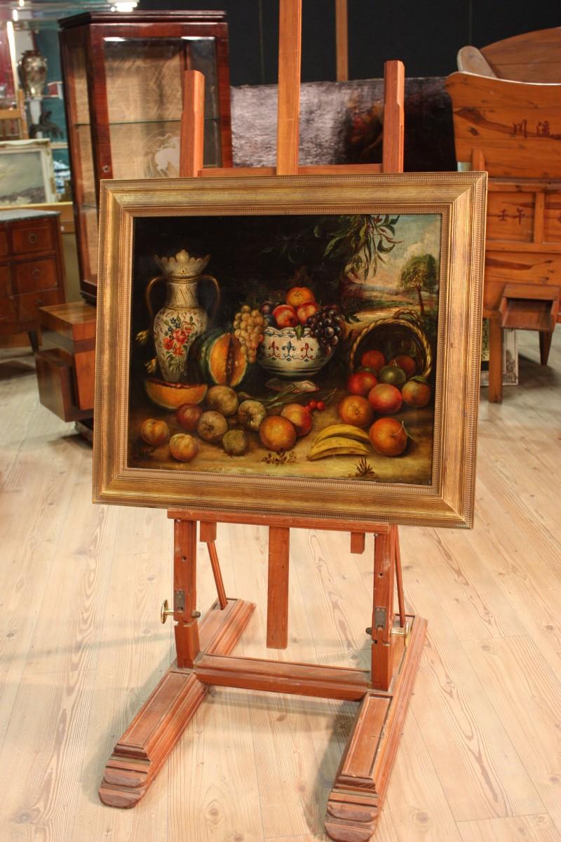 Spanish painting from the early 20th century. Opera oil on canvas of good pictorial quality depicting rich still life with vases and fruit. First canvas painting that has undergone some restorations during the twentieth century. Carved wooden frame