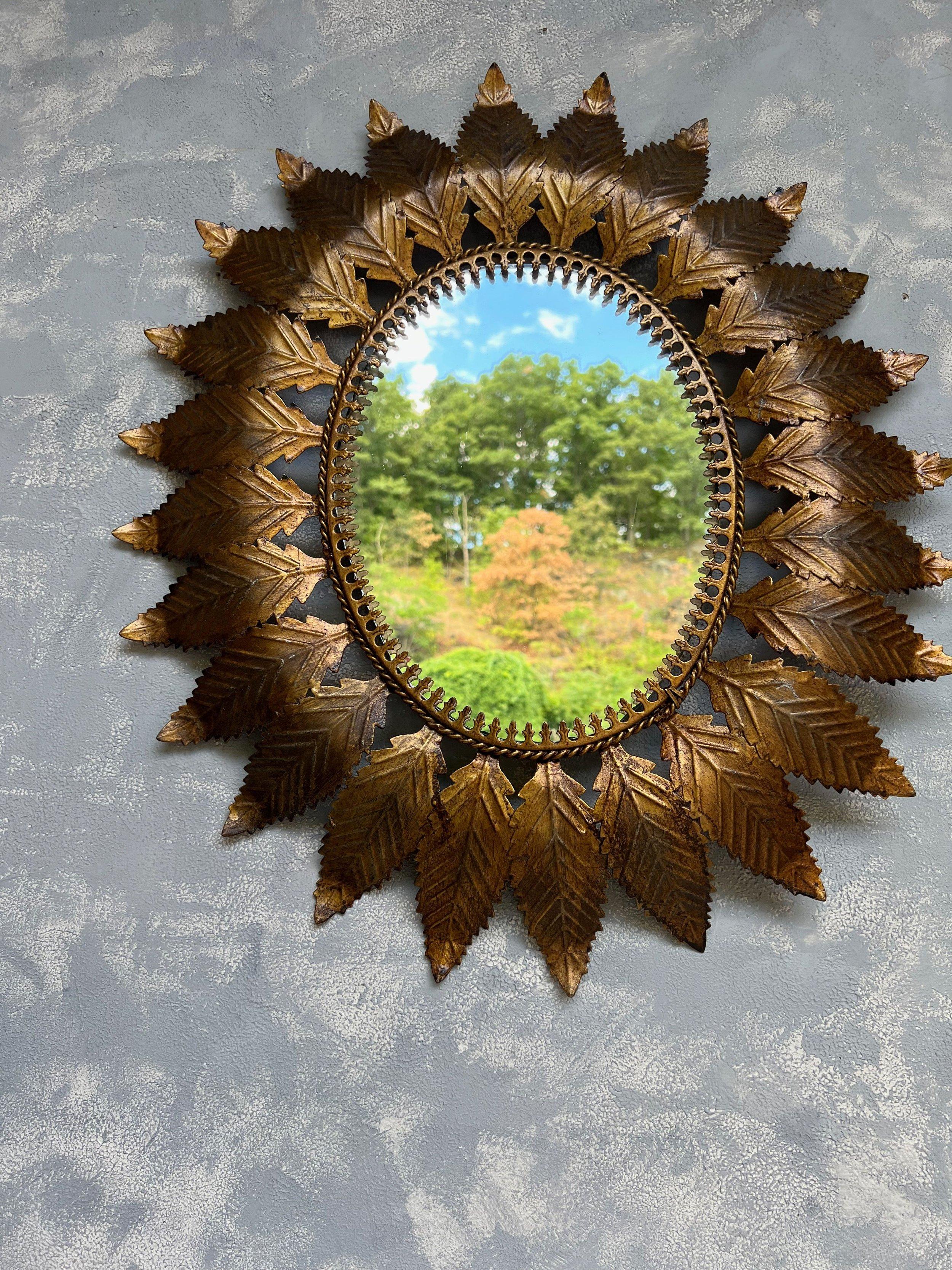 Mid-Century Modern Spanish Oval Gilt Metal Sunburst Mirror With Curved Radiating Leaves For Sale