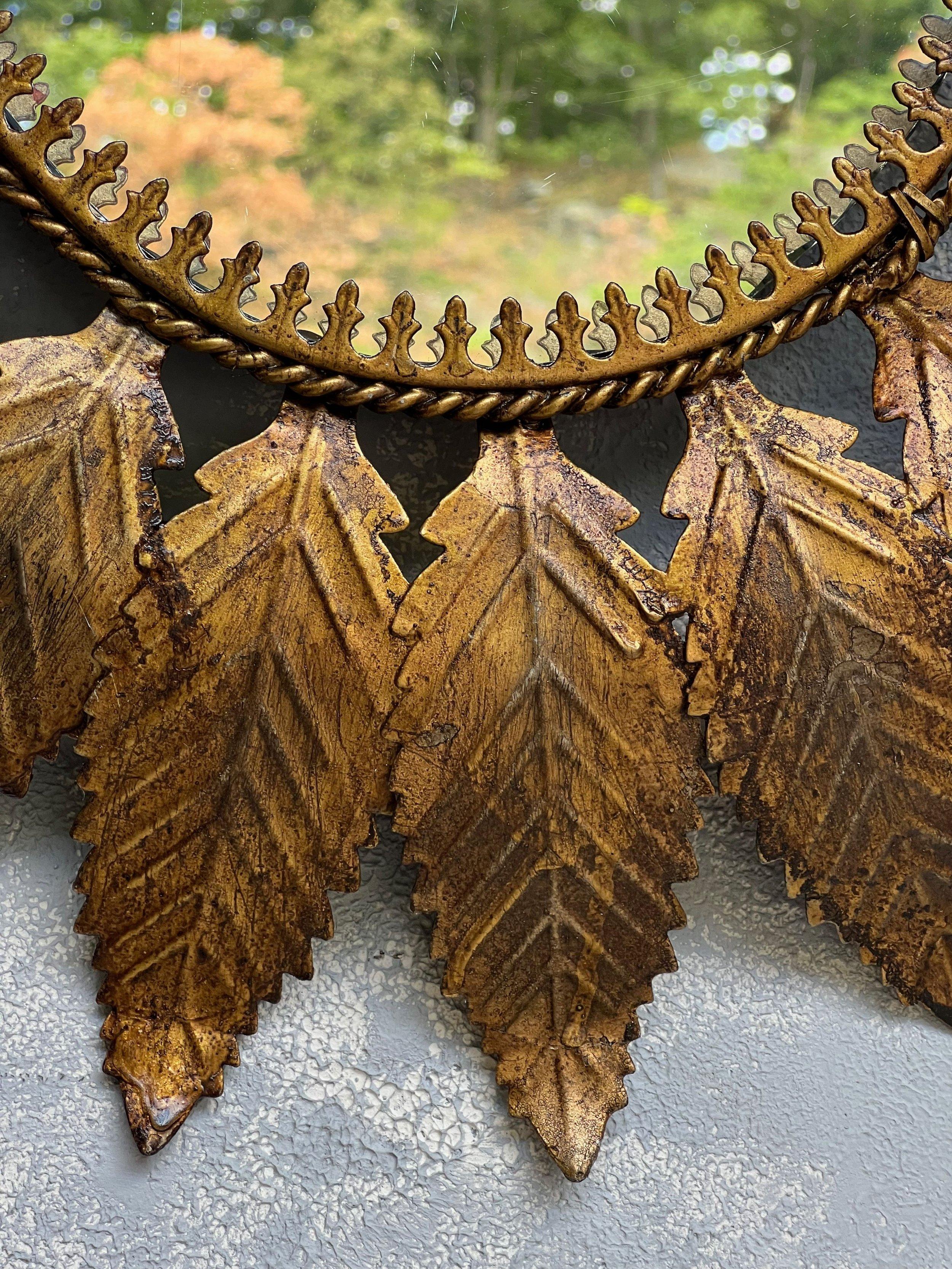 Mid-20th Century Spanish Oval Gilt Metal Sunburst Mirror With Curved Radiating Leaves For Sale