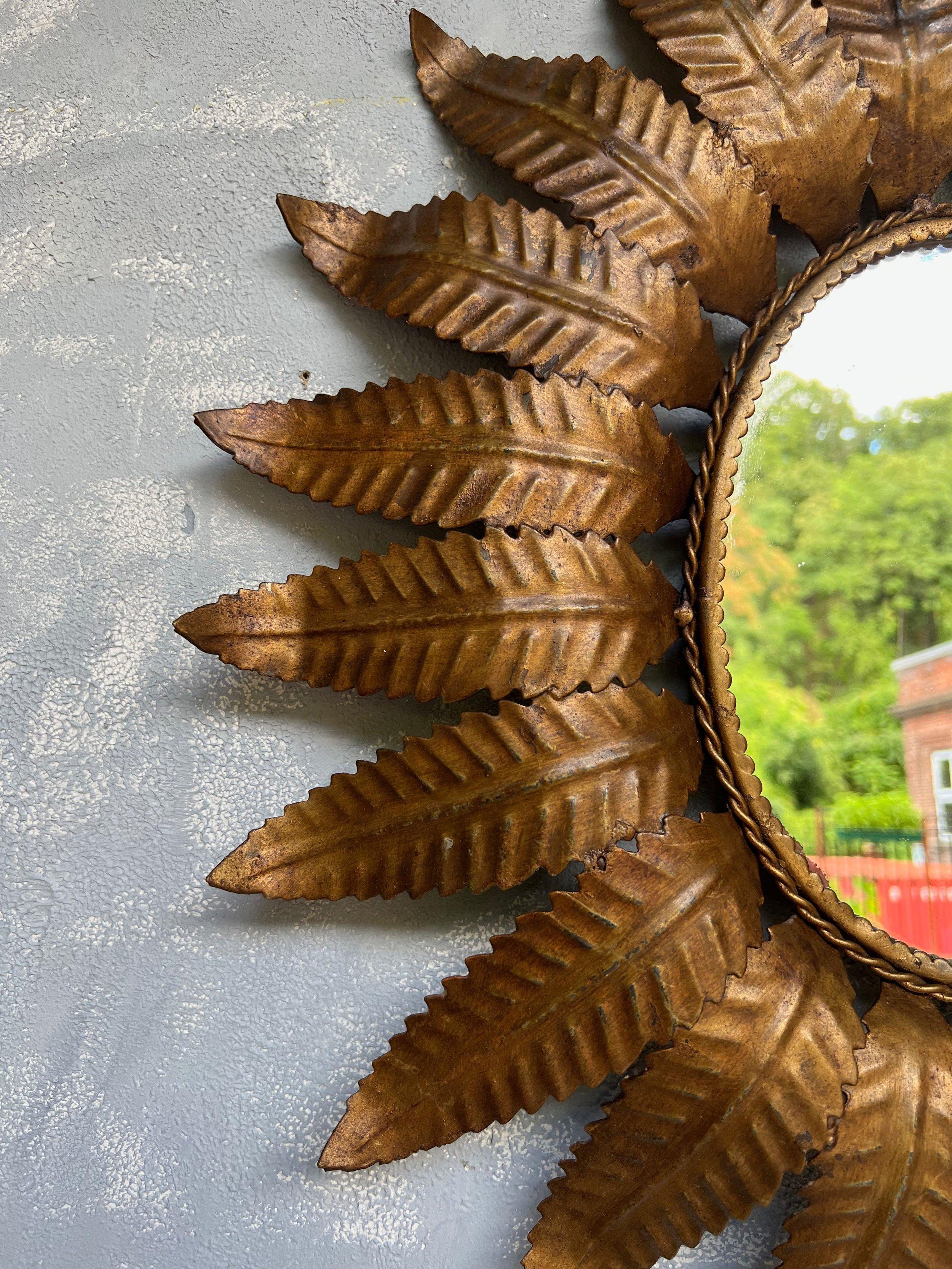 Spanish Oval Gilt Metal Sunburst Mirror with Dark Gilt Finish In Good Condition In Buchanan, NY