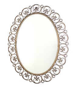 Espejo Oval Español de Hierro Dorado con Marco de Volutas