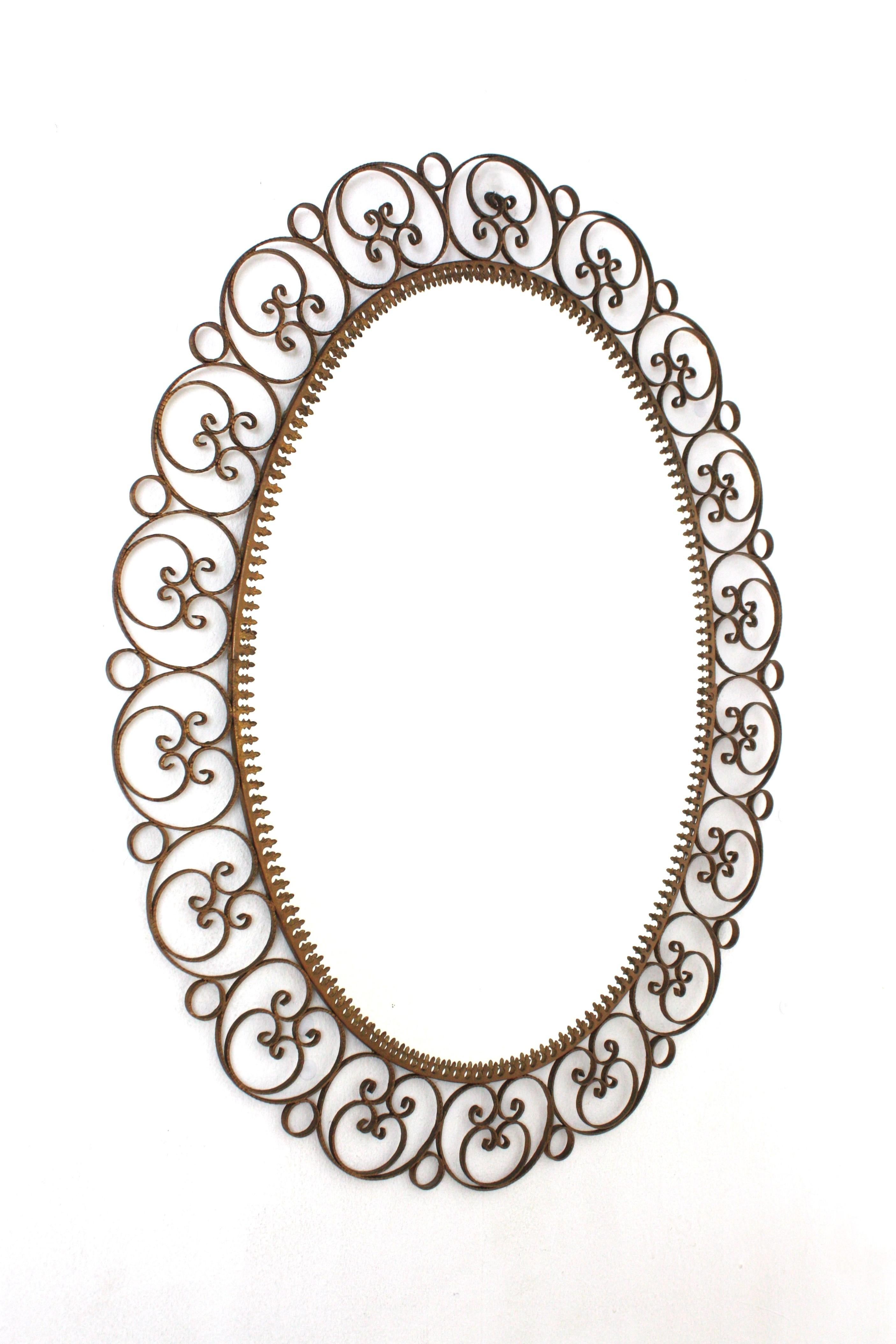 Hand-Crafted Spanish Oval Mirror in Gilt Iron with Scrollwork Frame For Sale