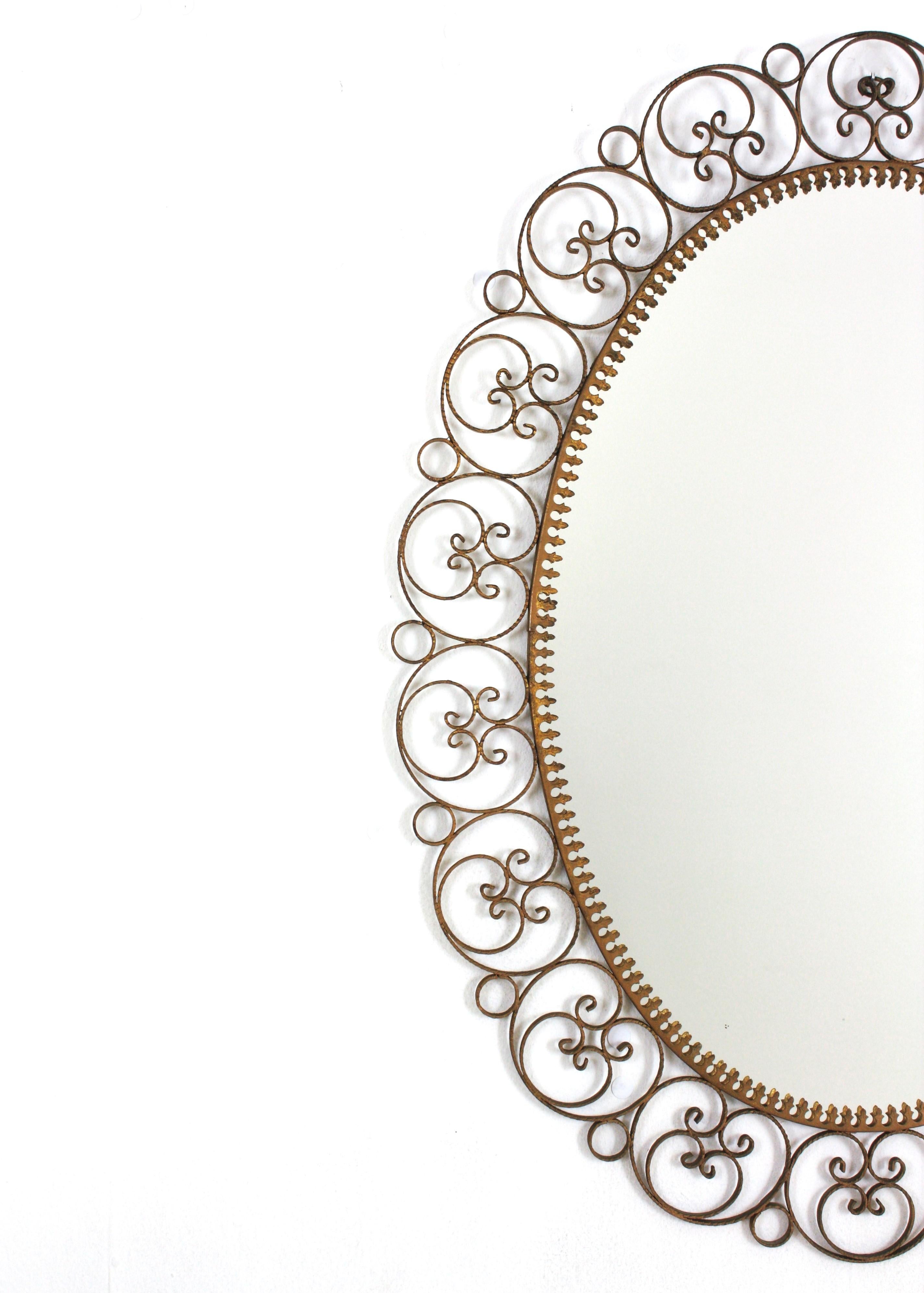Spanish Oval Mirror in Gilt Iron with Scrollwork Frame For Sale 1