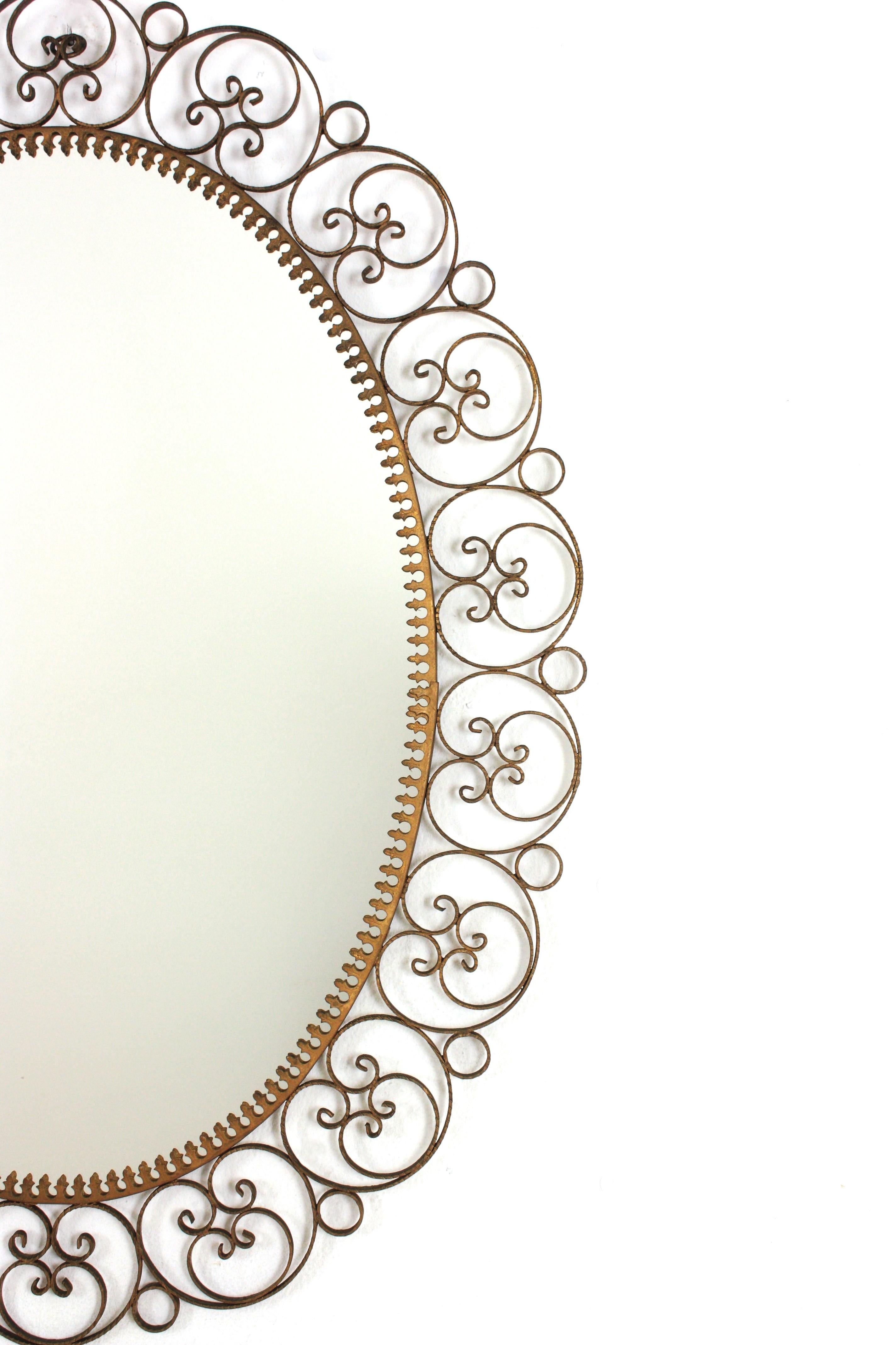 Spanish Oval Mirror in Gilt Iron with Scrollwork Frame For Sale 2