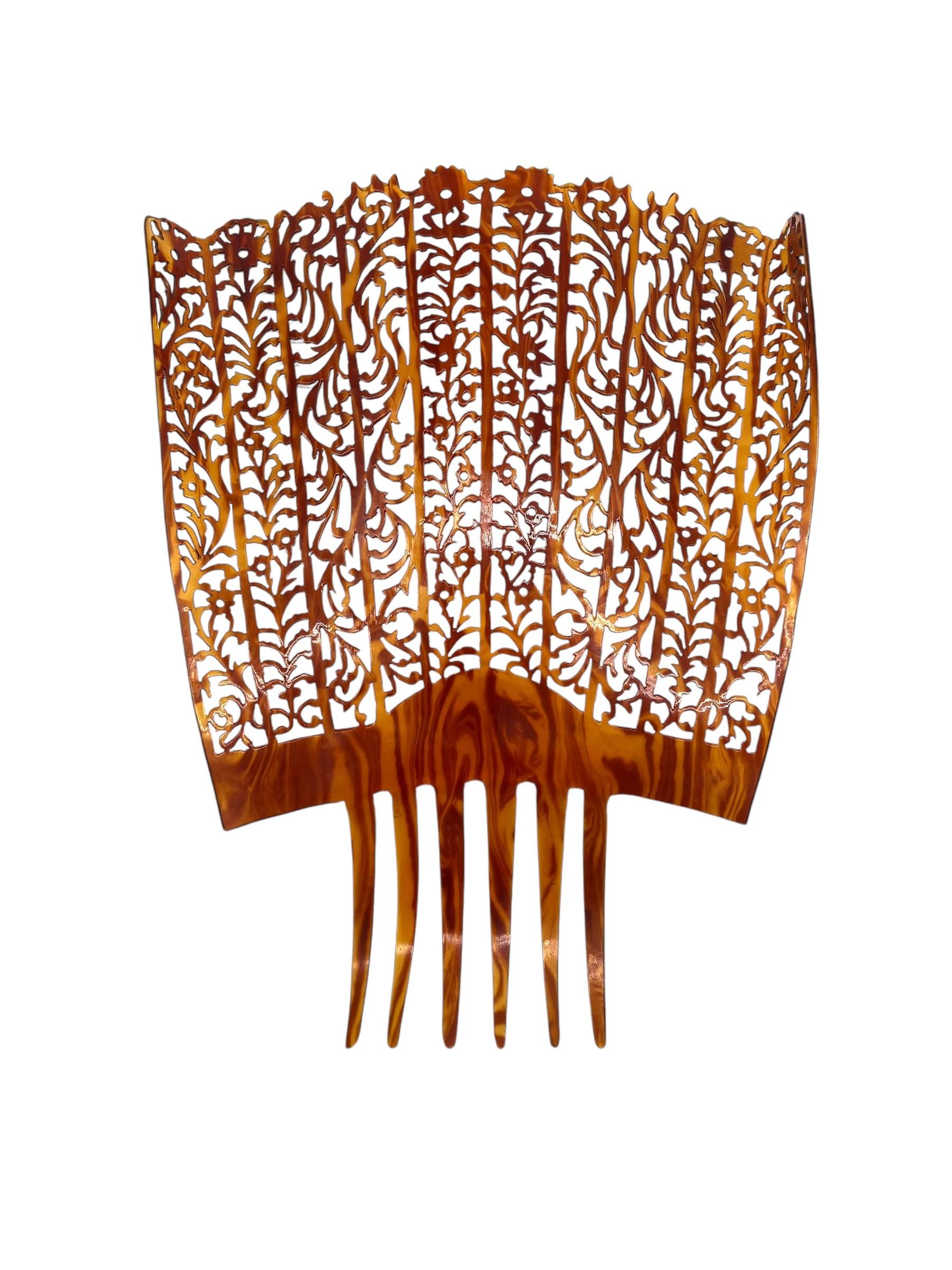 Exquisite Spanish peinata carved in an art nouveau filigree design. Wearable art in it's truest form.  The peineta, or hair comb, is traditionally worn under a lace veil known as a mantilla. The peineta is primarily used during special occasions