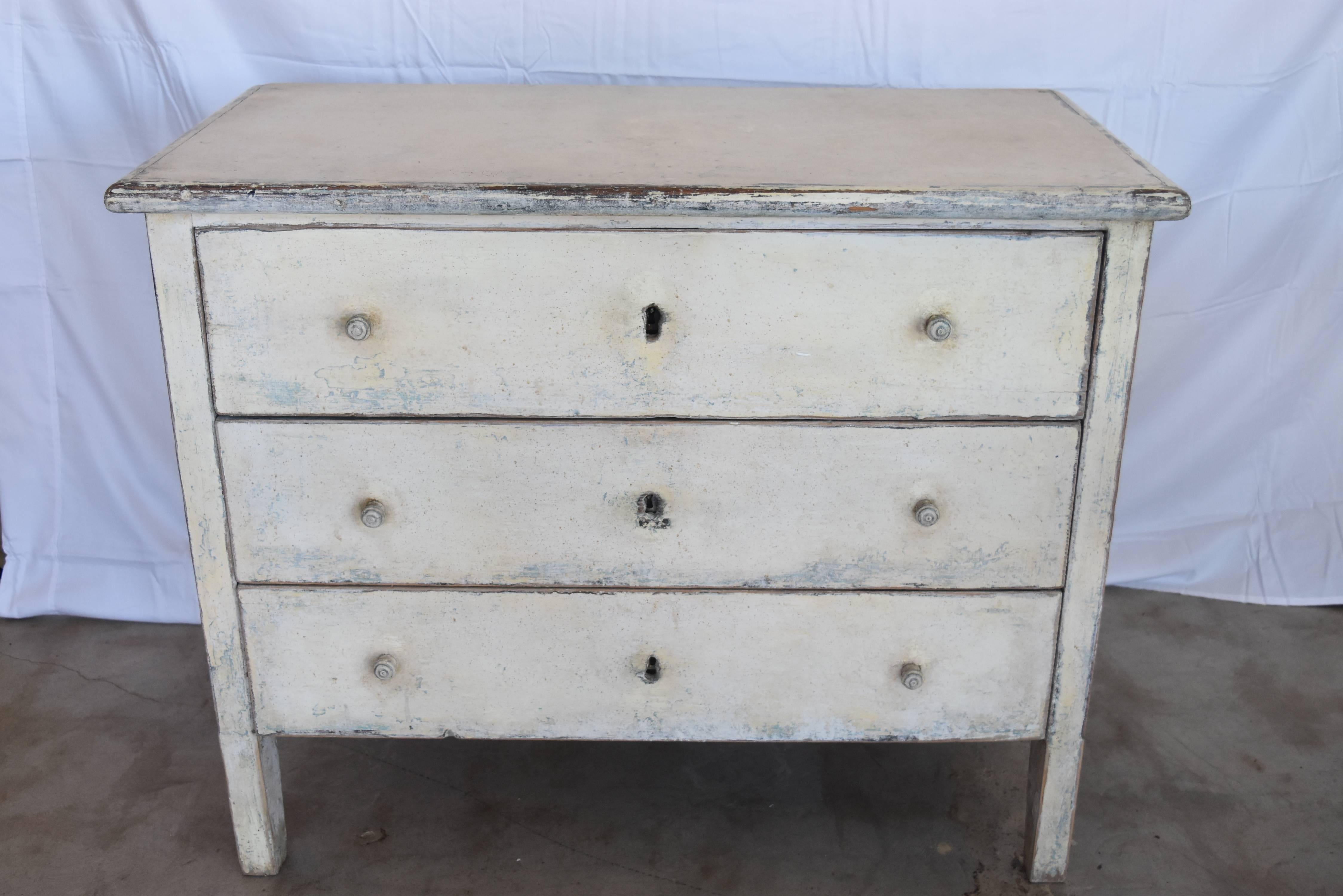 These chest are made from 19th century buffets and chests in order to have pairs. They are beautifully layered in paint like the old way. You can see the blue under the cream and have wooden hand pulls on each drawer. They glide smoothly and are in