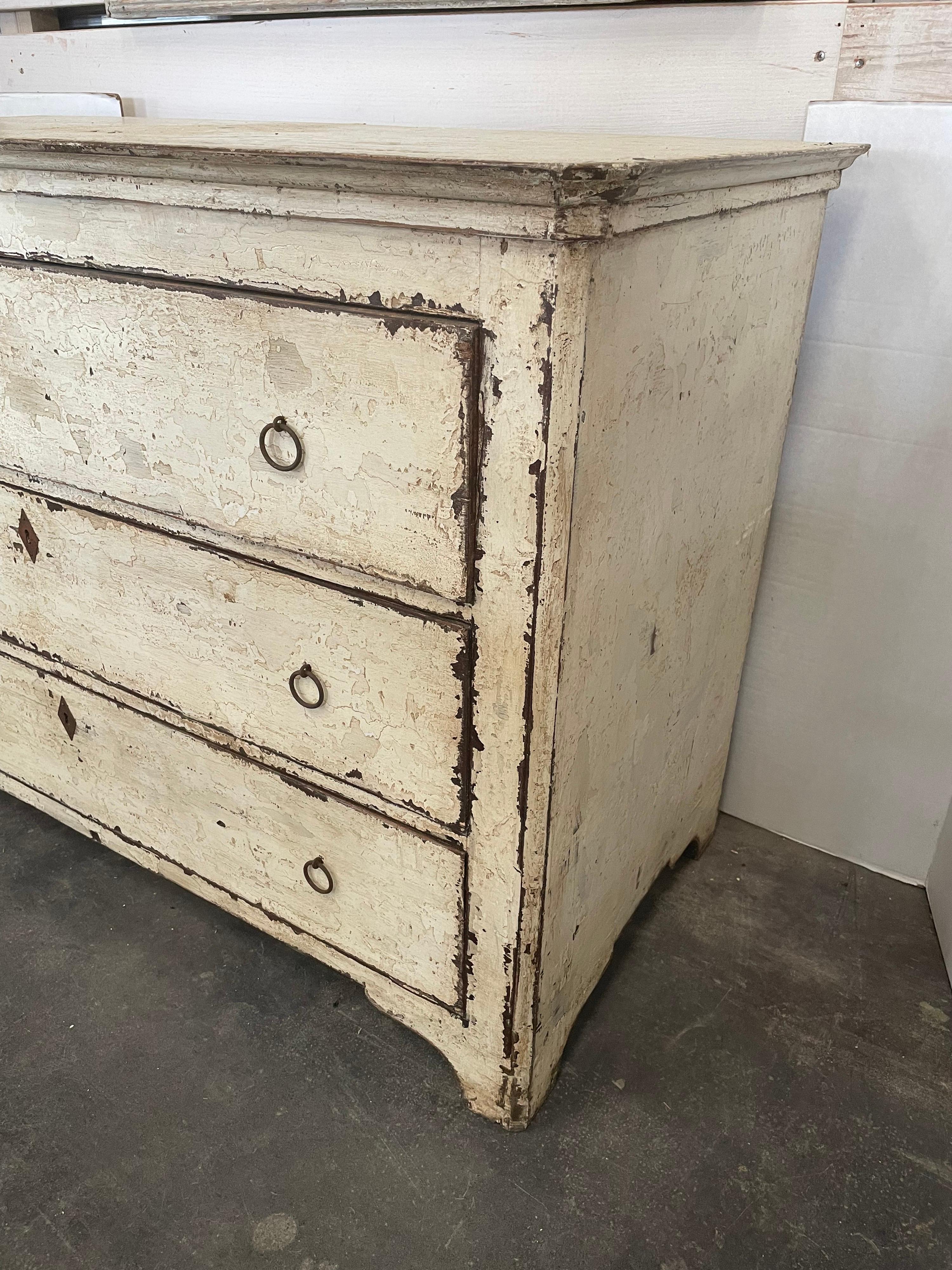 This is a beautiful chest with round aged pulls. It’s from Spanish origin made from old buffets, chests and newer wood. The paint is newly done the old way using a layering technique. You can see in the photos the variation of paints used.