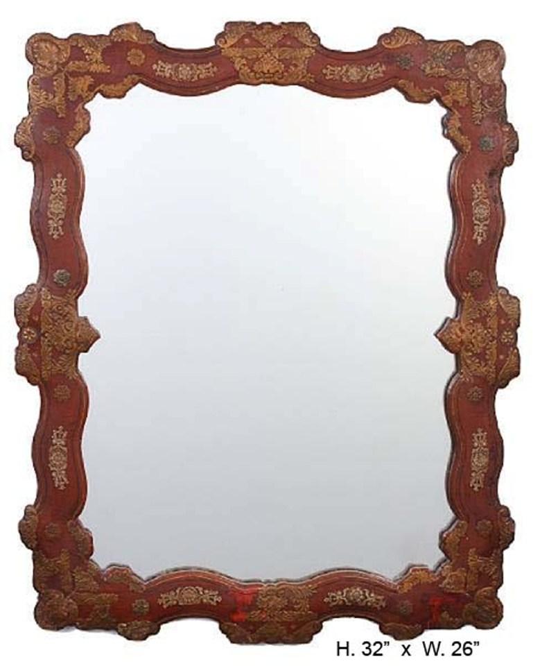 Unique Spanish parcel gilt red leather mirror. 
Beautifully detailed and attractive.