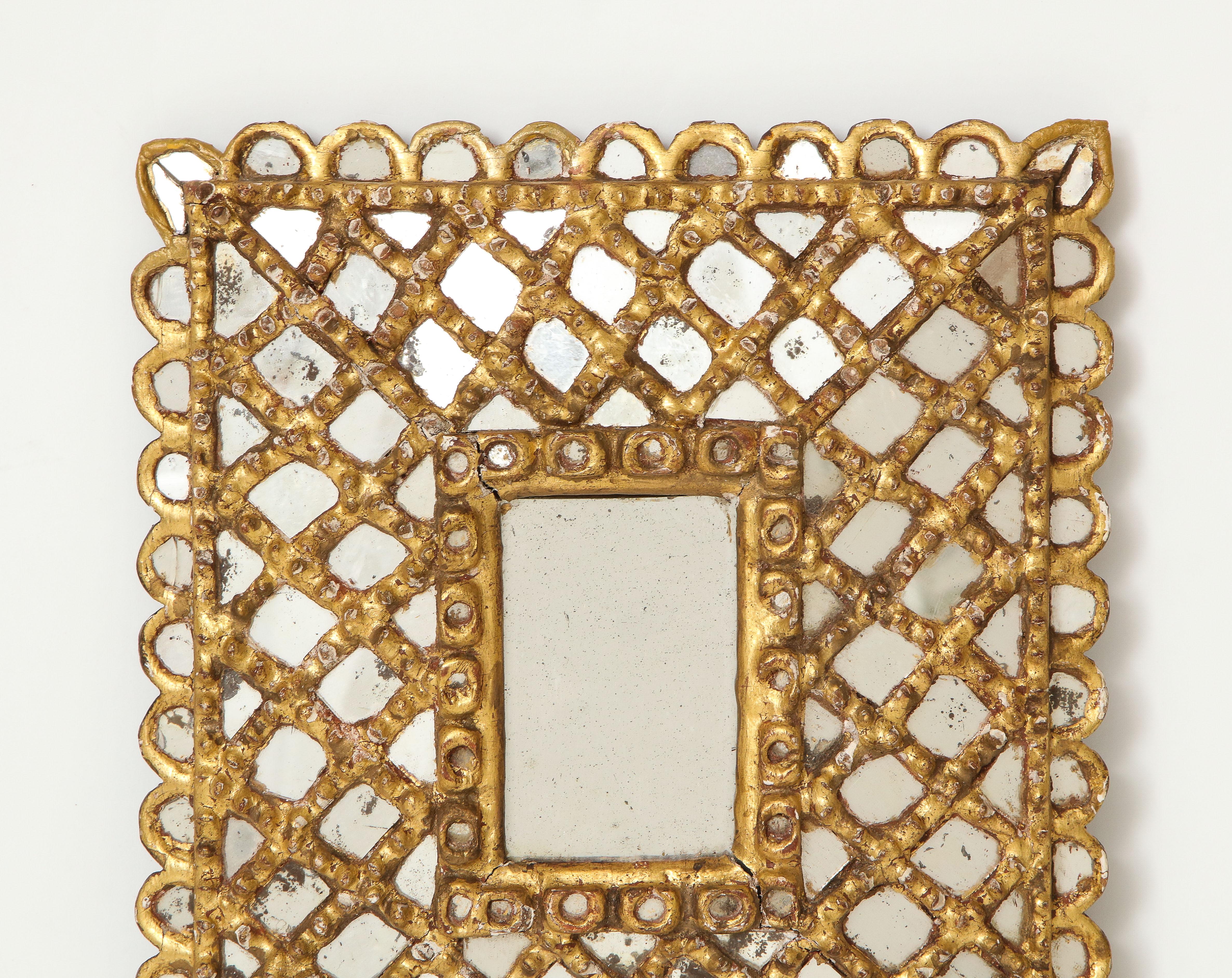 A charming Spanish 1920s petite gilded and carved wood frame with mirrored insets.
Spain, circa 1920.
Size: 13