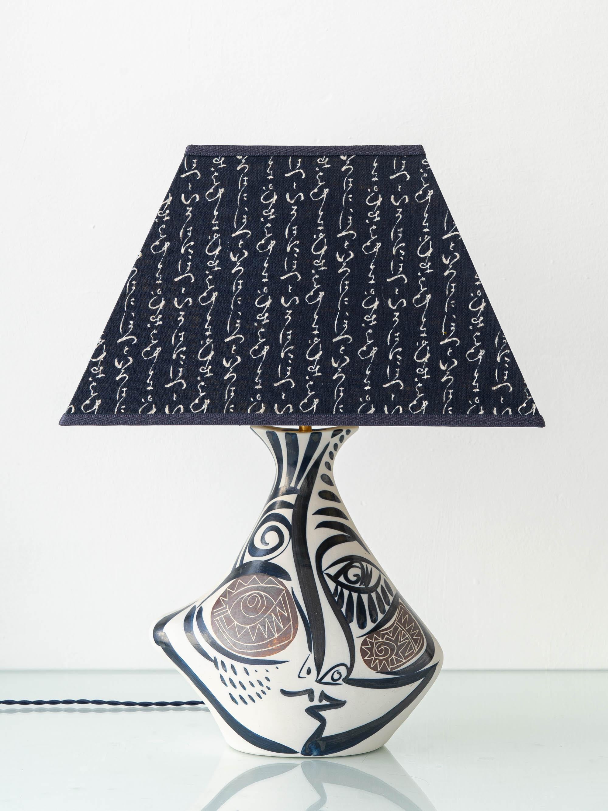 Meticulously hand-crafted by Amitābha Studio from a vintage Alfonso Otero Regal ceramic vase, this Picasso-style Cubist Spanish table lamp pairs avant-garde artistry with a bespoke trapezoid lampshade in a Japanese cotton print, lined with