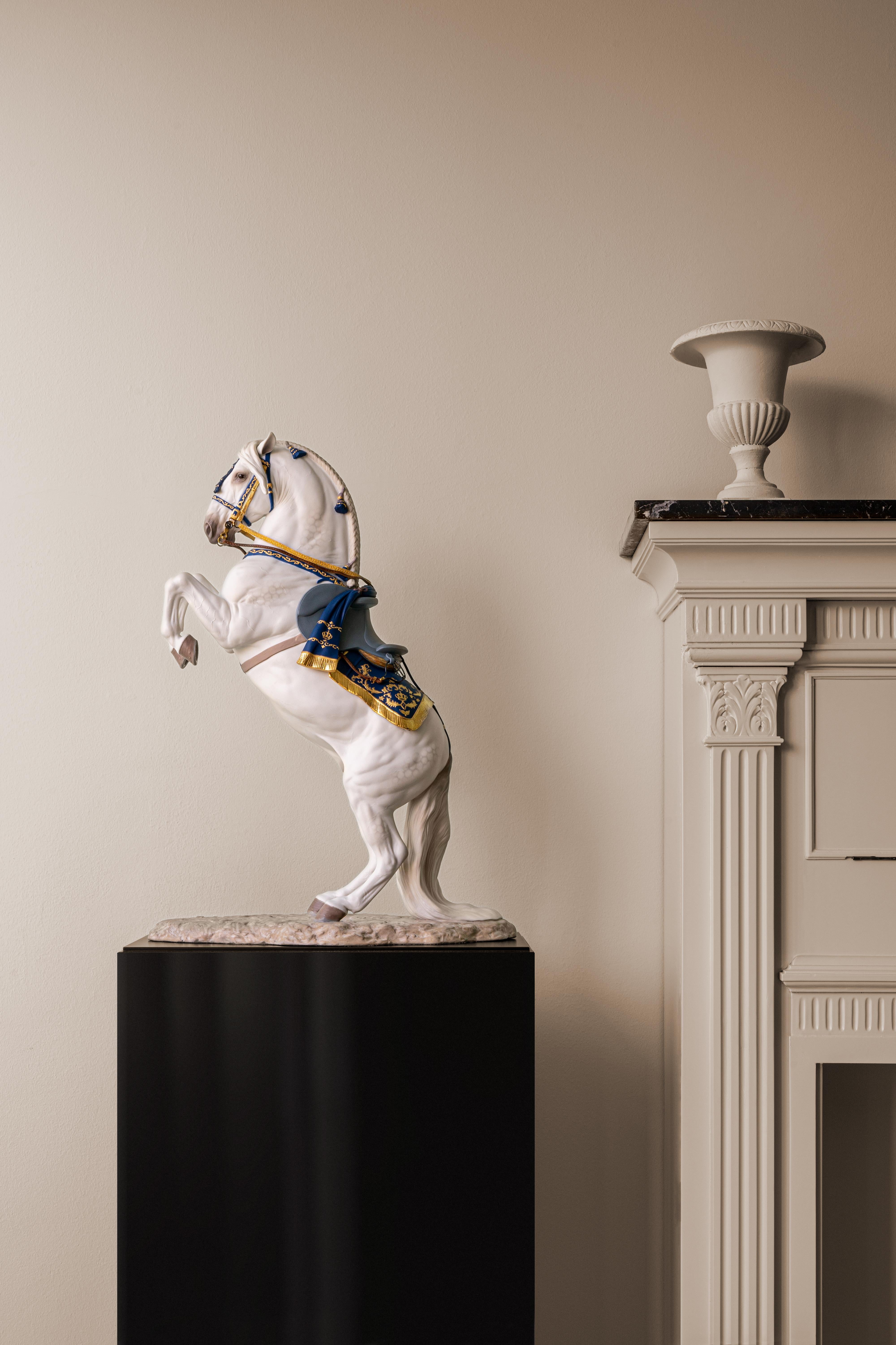 Limited edition High Porcelain sculpture of a Spanish pure breed horse carrying out a dressage exercise. Spanish Pure Breed - Haute École is a porcelain sculpture in a limited edition of 500 units which depicts one of the world’s most prestigious