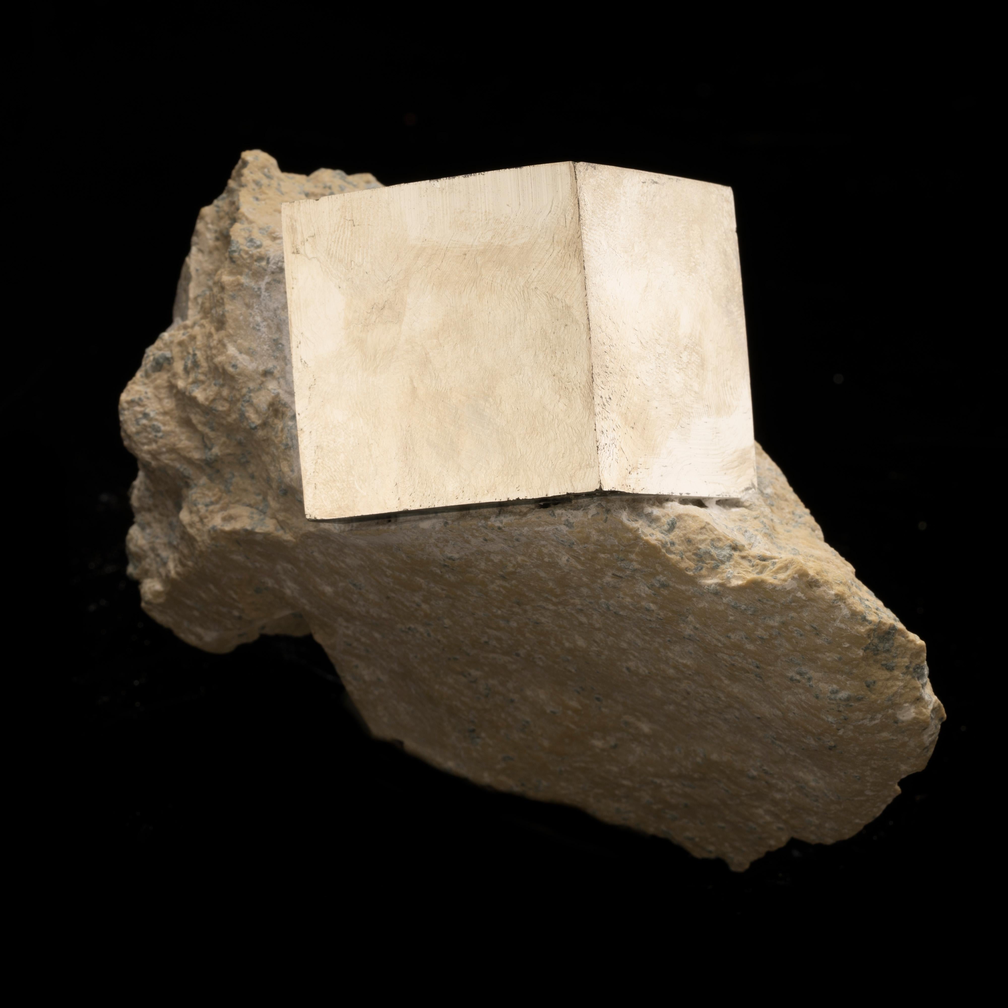 This astonishing 1.65 lb. specimen from Navajún, Spain features the rarity of a completely natural pyrite rectangle – measuring a substantial 1-5/8