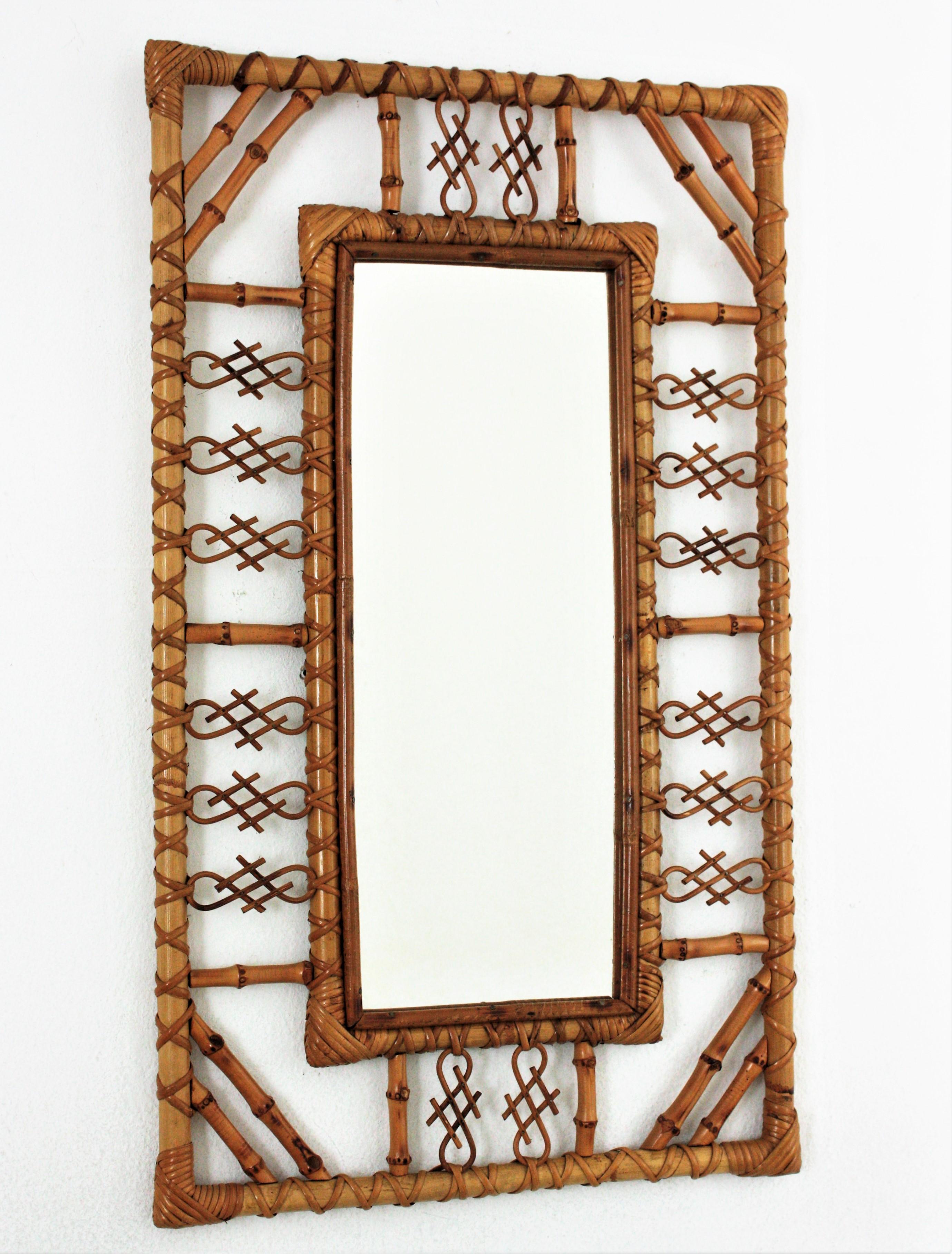 Midcentury rectangular mirror, rattan, bamboo. Spain, 1960s.
The mirror has chinoiserie and bamboo decorations on the frame and joining the corners.
It will be eye-catching in an entry hall, bathroom or bedroom and it will add a midcentury accent