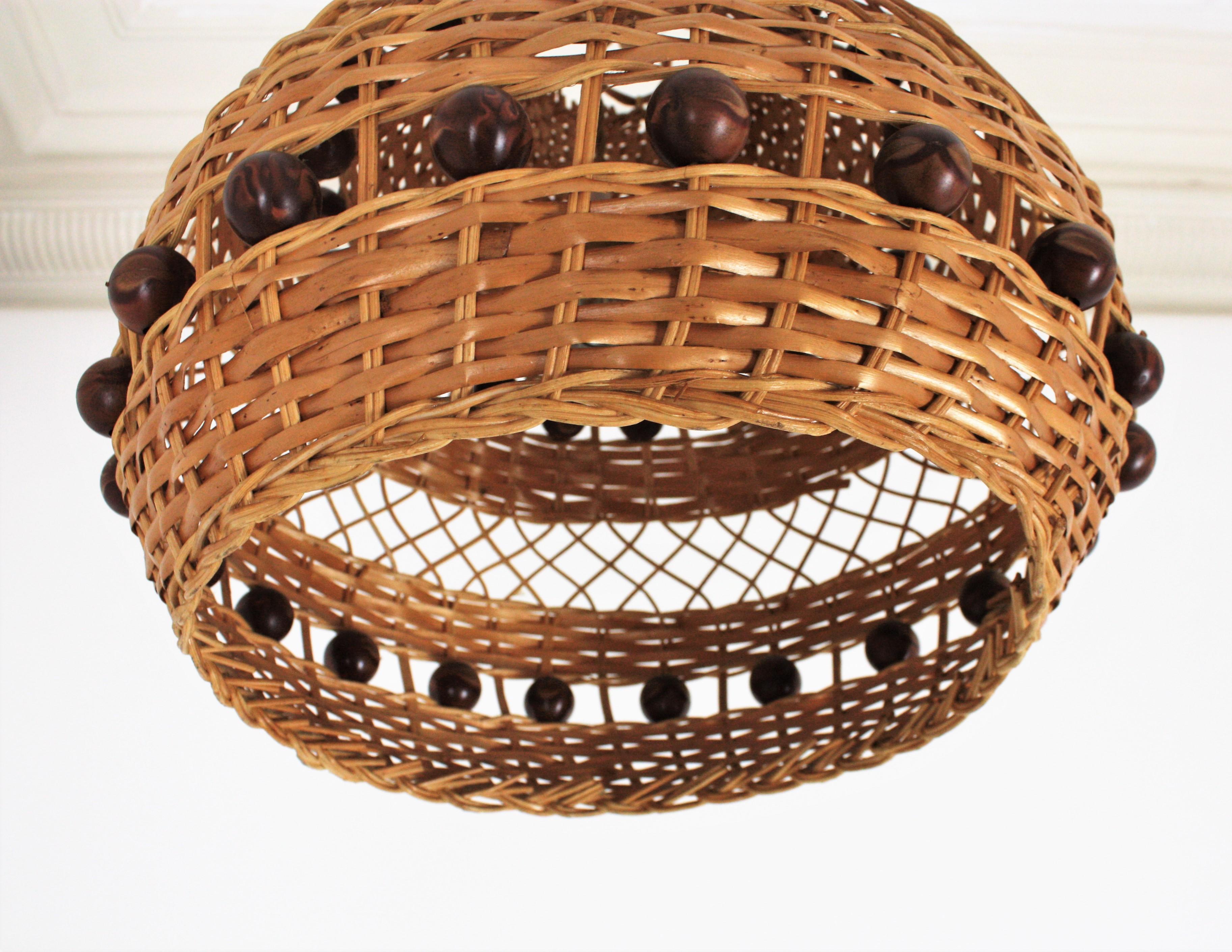 Mid-Century Modern Spanish Rattan Pendant Light / Lantern with Balls Accents For Sale