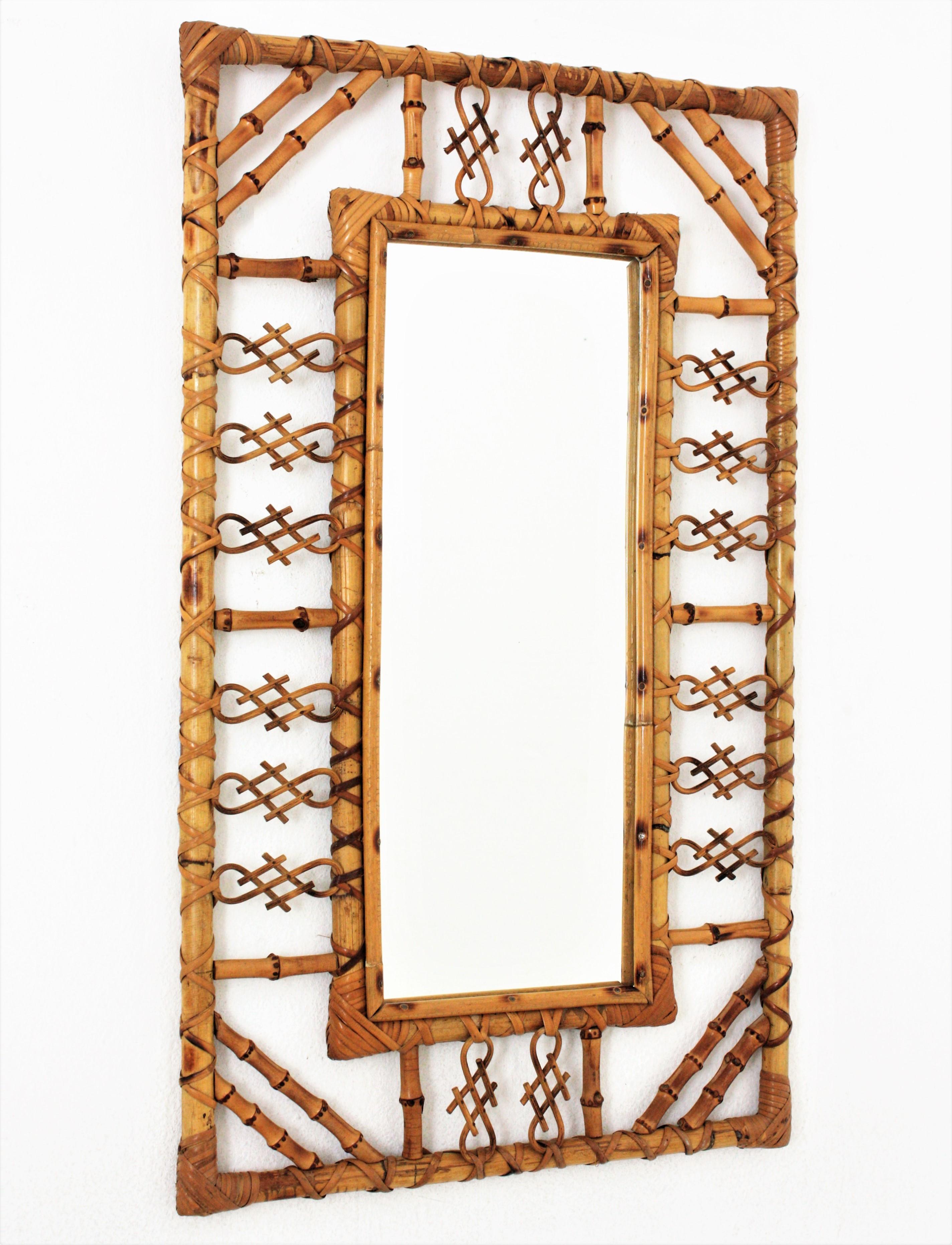 Midcentury rectangular mirror, rattan, bamboo. Spain, 1960s.
This handcrafed mirror has chinoiserie and bamboo decorations on the frame and joining the corners.
It will be eye-catching in an entry hall, bathroom or bedroom and it will add a