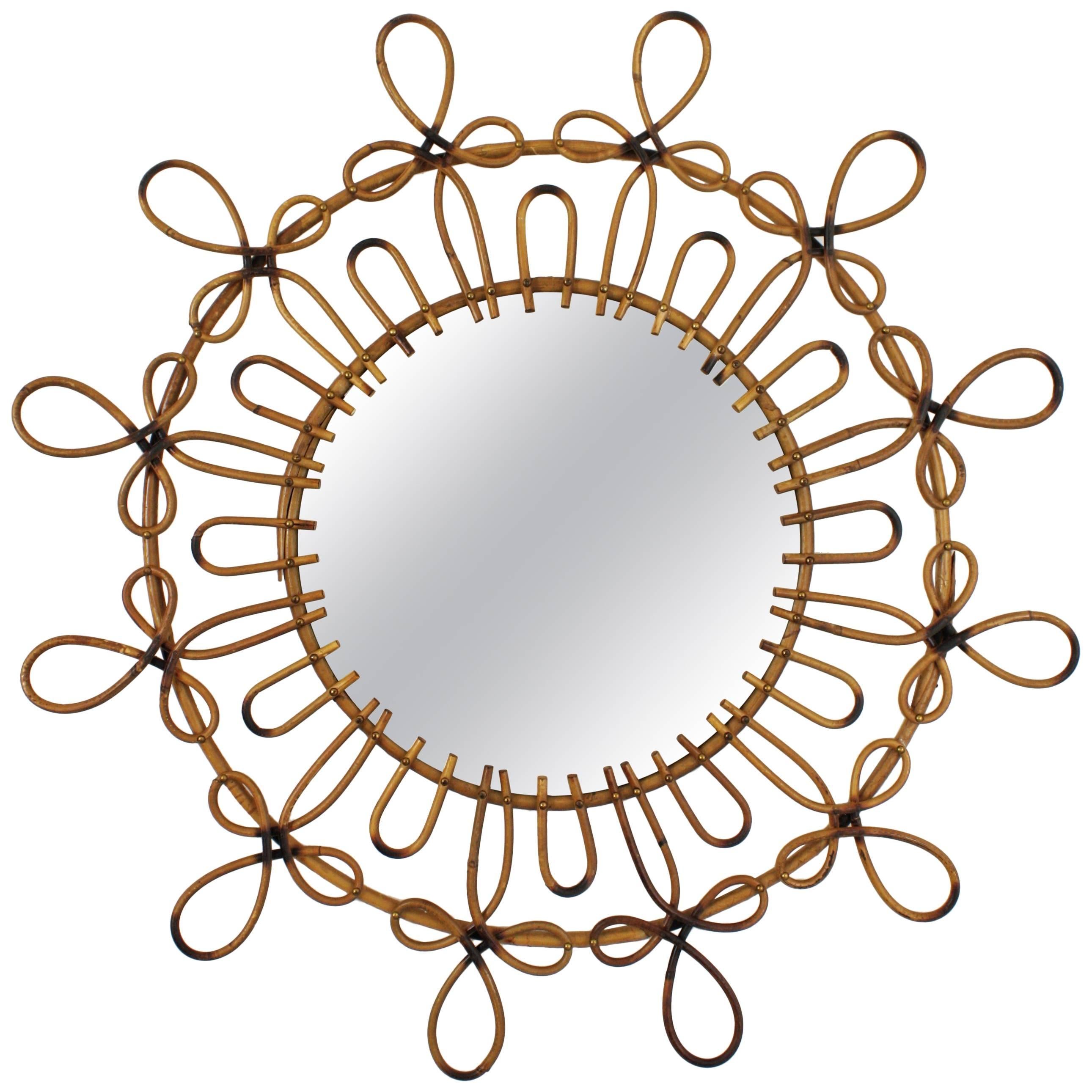 Sculptural Spanish handcrafted wicker or rattan mirror with two decorative layers of loops and pyrography details. Spain, 1960s.
Highly decorative to place it alone or creating a wall decoration with other mirrors in this manner. Excellent vintage