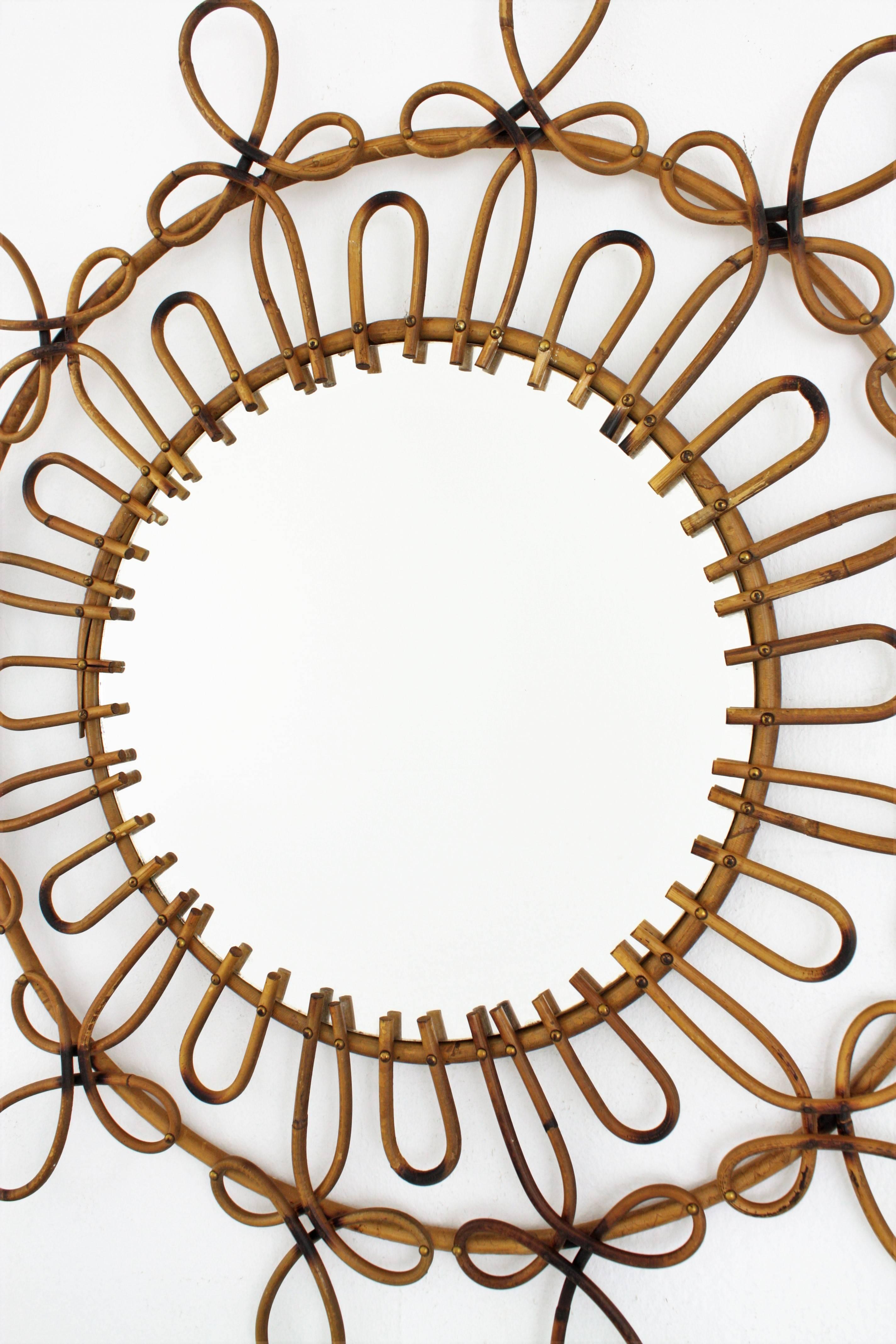 Mid-Century Modern Spanish Rattan and Wicker Flower Burst Mirror with Loops and Pyrography Details