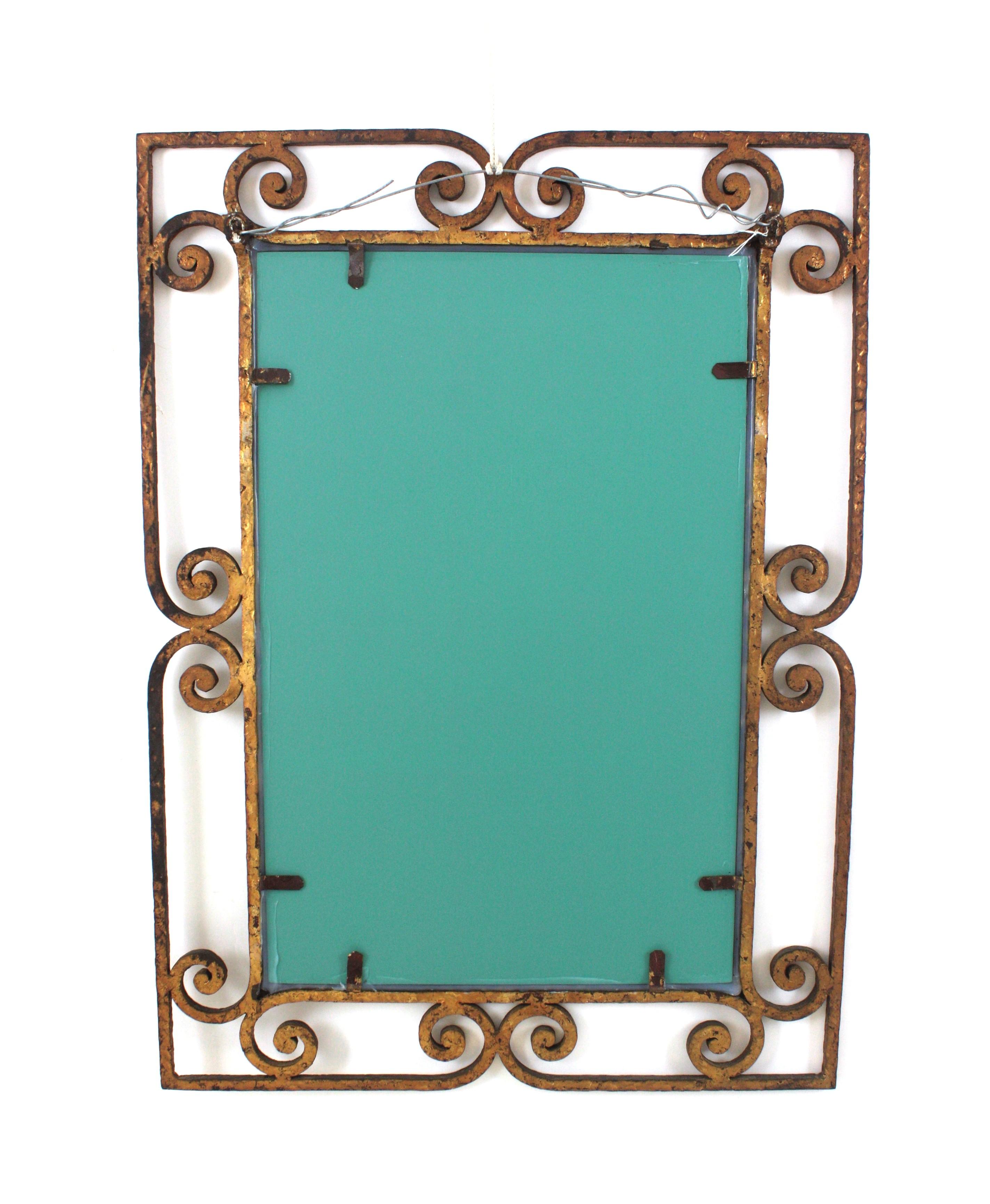 Gilt Rectangular Wall Mirror, Wrought Iron, Gold Leaf
Spanish hand forged iron mirror with scrollwork details, 1940s
Eye-catching hand forged iron mirror with scroll decorations on the frame and a gorgeous design with spanish colonial