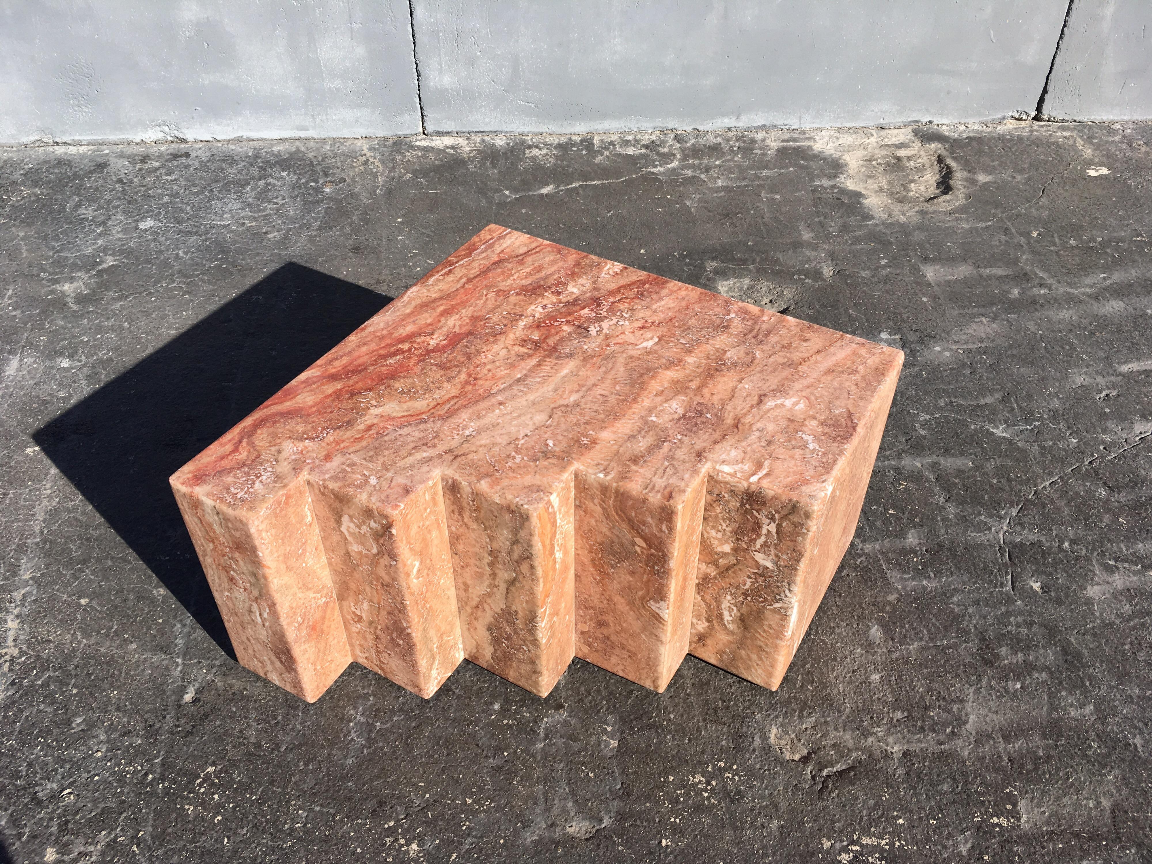 Spanish Red Travertine Coffee table, table has inserted metal casters. Made in Italy.