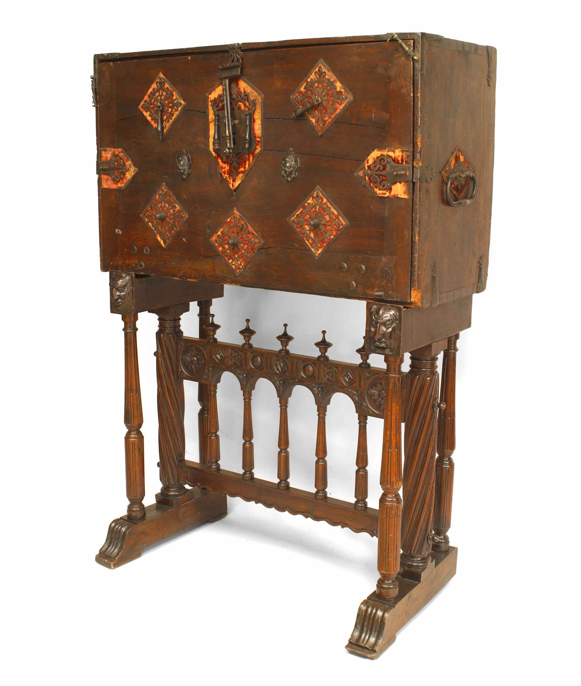 Spanish Renaissance style (17th Century and Later) wrought iron mounted walnut vargueno on later stand with a fall front enclosing 3 long drawers.

