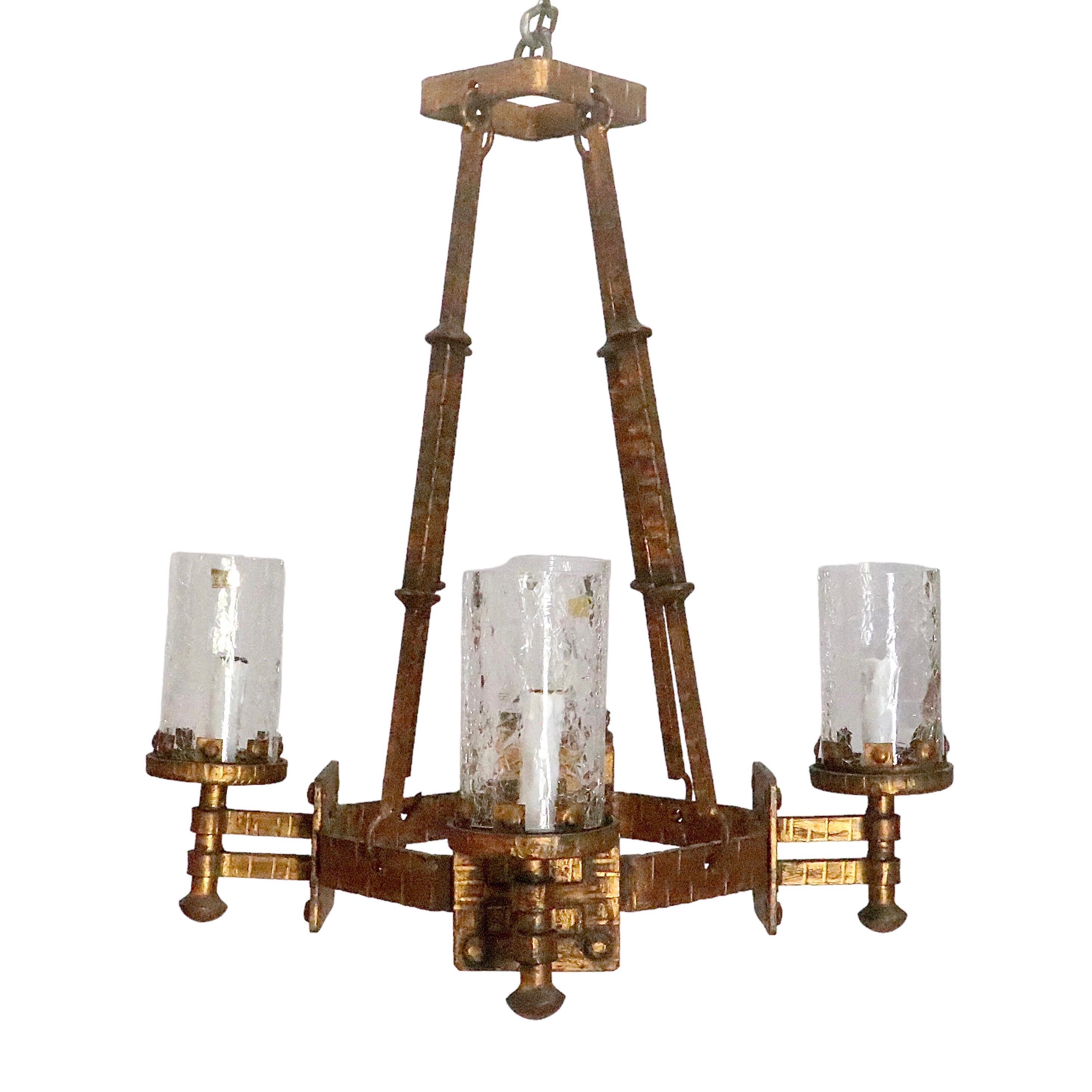 This beautiful hanging light is authentic hand forged wrought iron. Decorated with beautiful hand made iron accents. 

Features an antique gold finish.

Circa 2000.

Total Fixture Dimension: Total Drop Height: 24 inches x Width: 21 inches; hanging