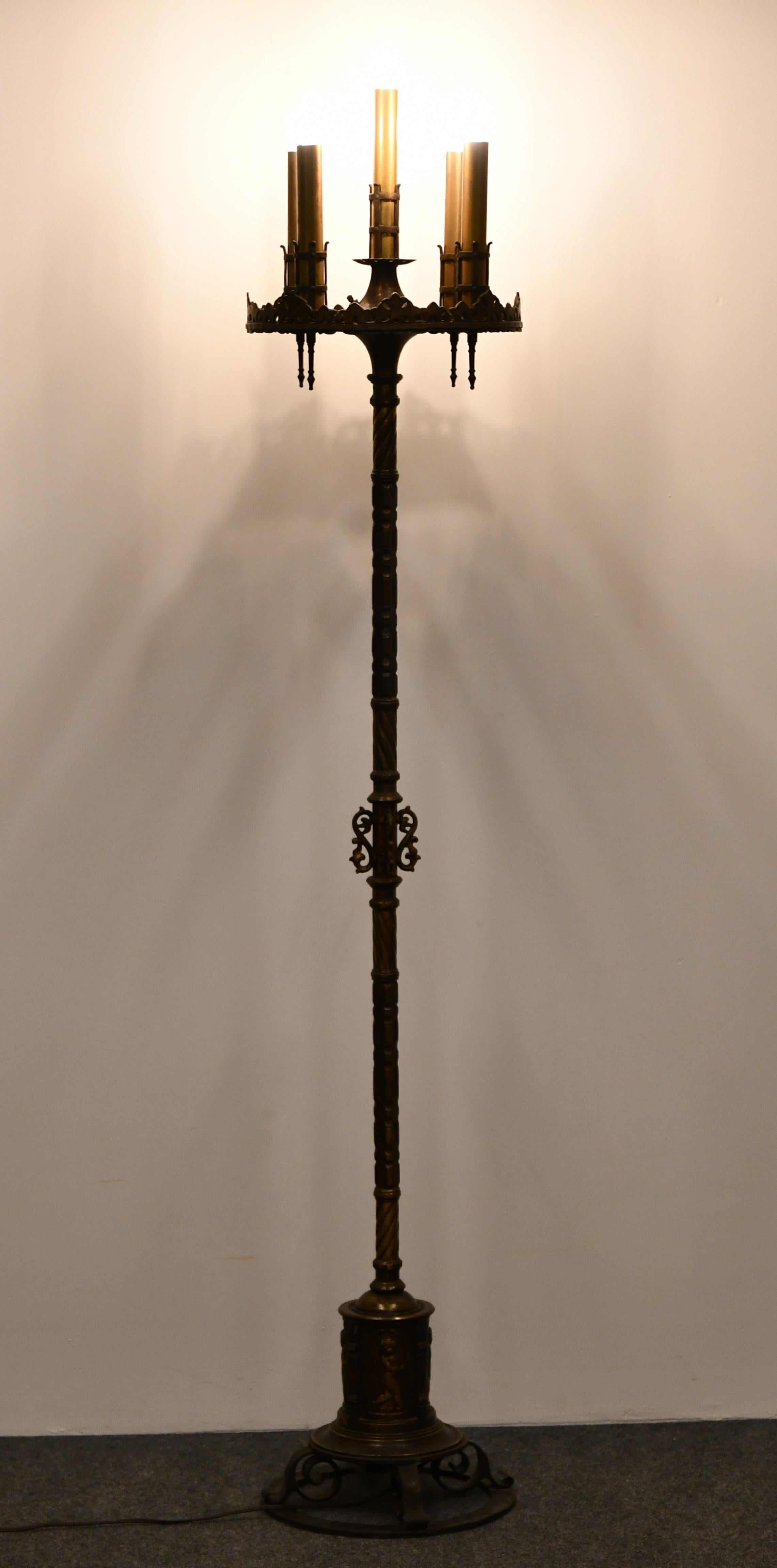 A Spanish Revival solid bronze Torchière Designed by Oscar Bach, 1920s.  
The metal finish is in very good condition, the wiring appears to be original and functions properly.

A monumental Spanish revival bronze torchère designed by Oscar Bach,