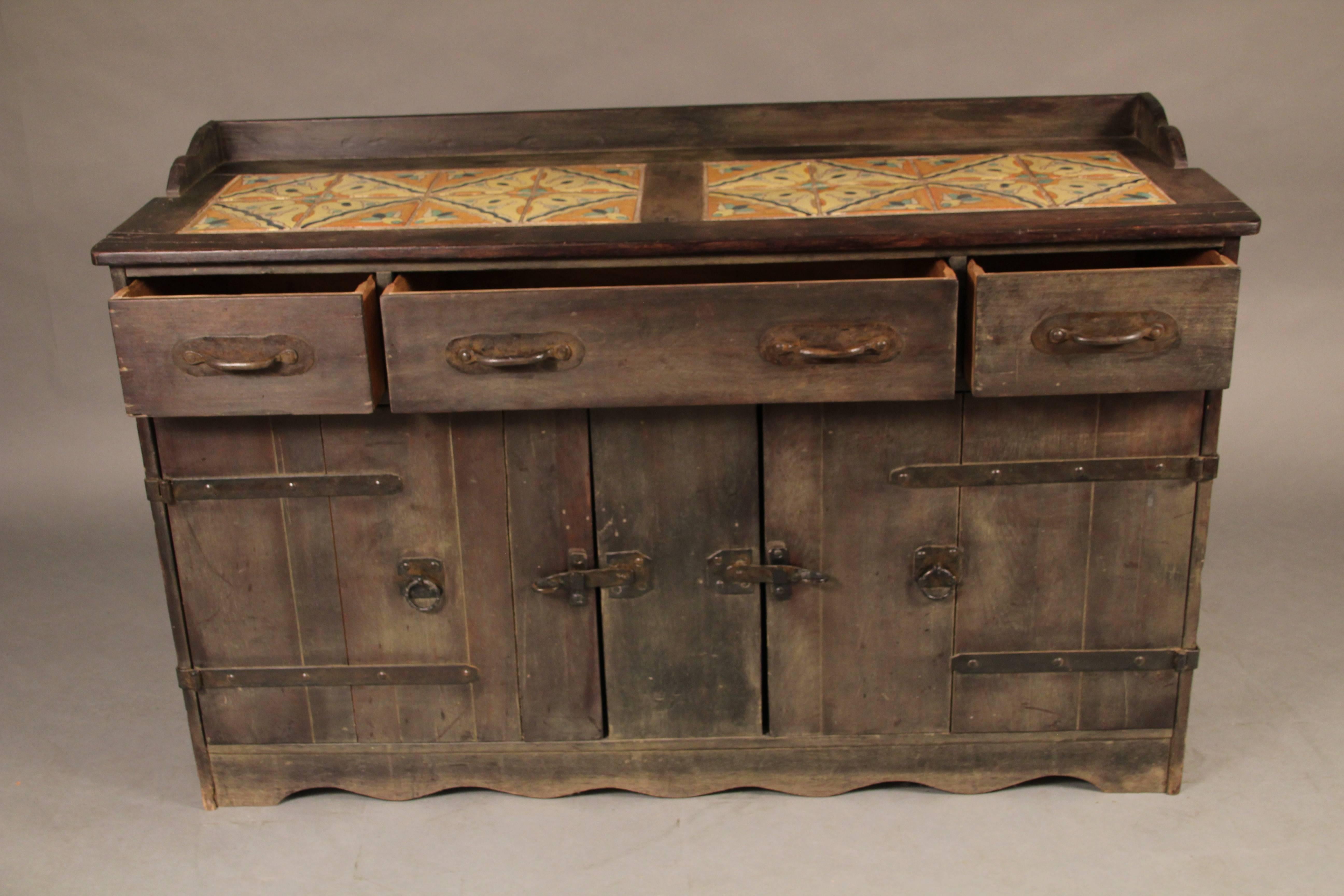 Signed Monterey tile top sideboard with original old wood finish and great tile top, circa 1930s.
