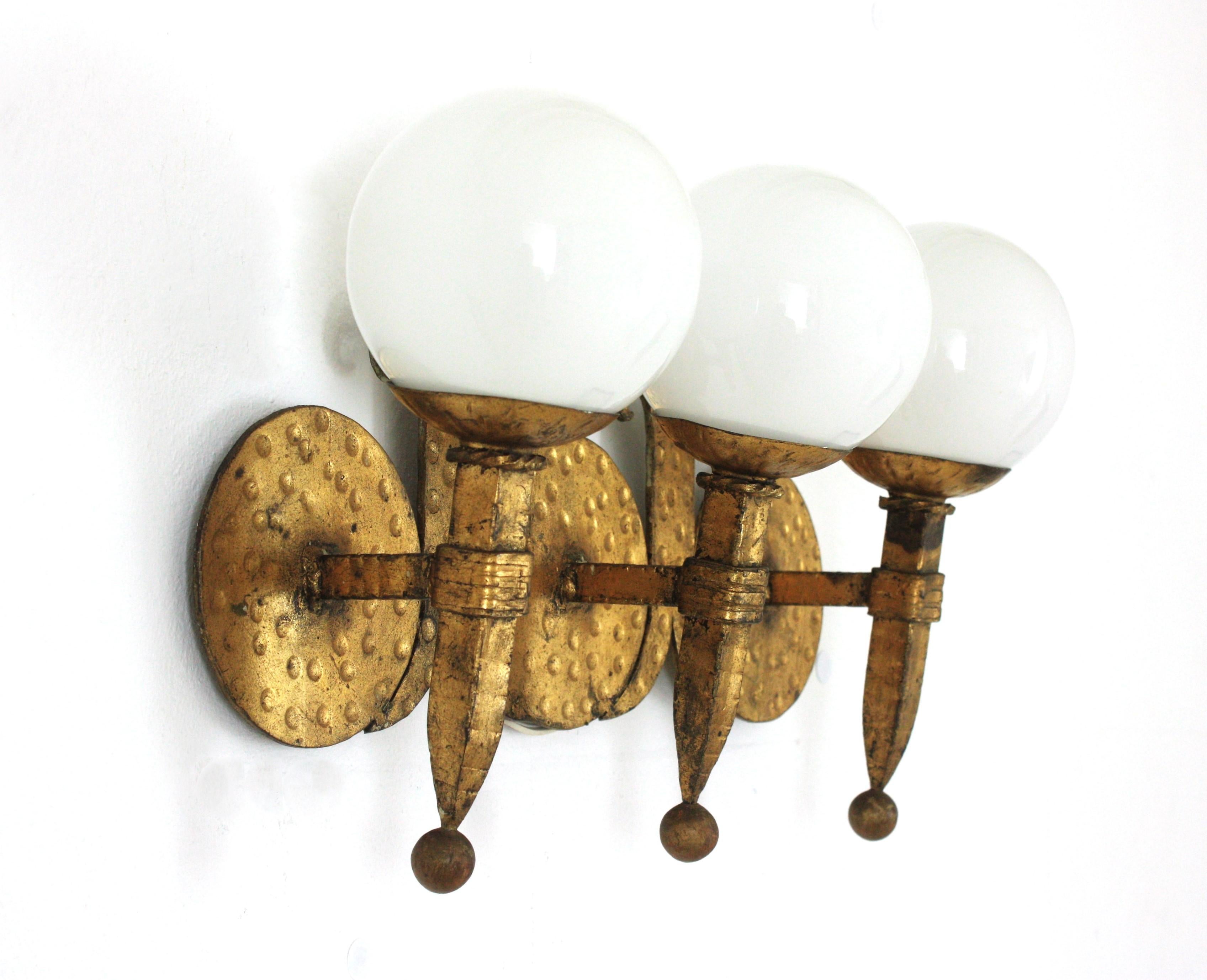 Hand-Crafted Torch Wall Light in Gilt Iron with Milk Glass Globes, Spain 1940s For Sale