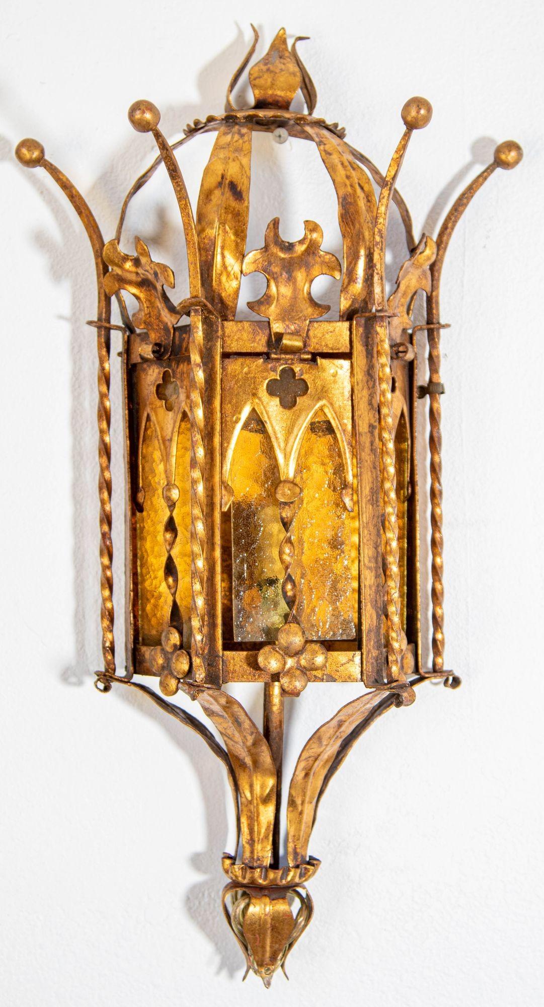 Spanish Revival Gothic Hand Forged Metal Gilt Wall Sconces circa 1930s
Pair of circa 1950's Spanish Revival gilt metal wall lanterns with original finish and amber stained glass.
Spanish Revival Addison Mizner Style Spanish Colonial Gothic wall