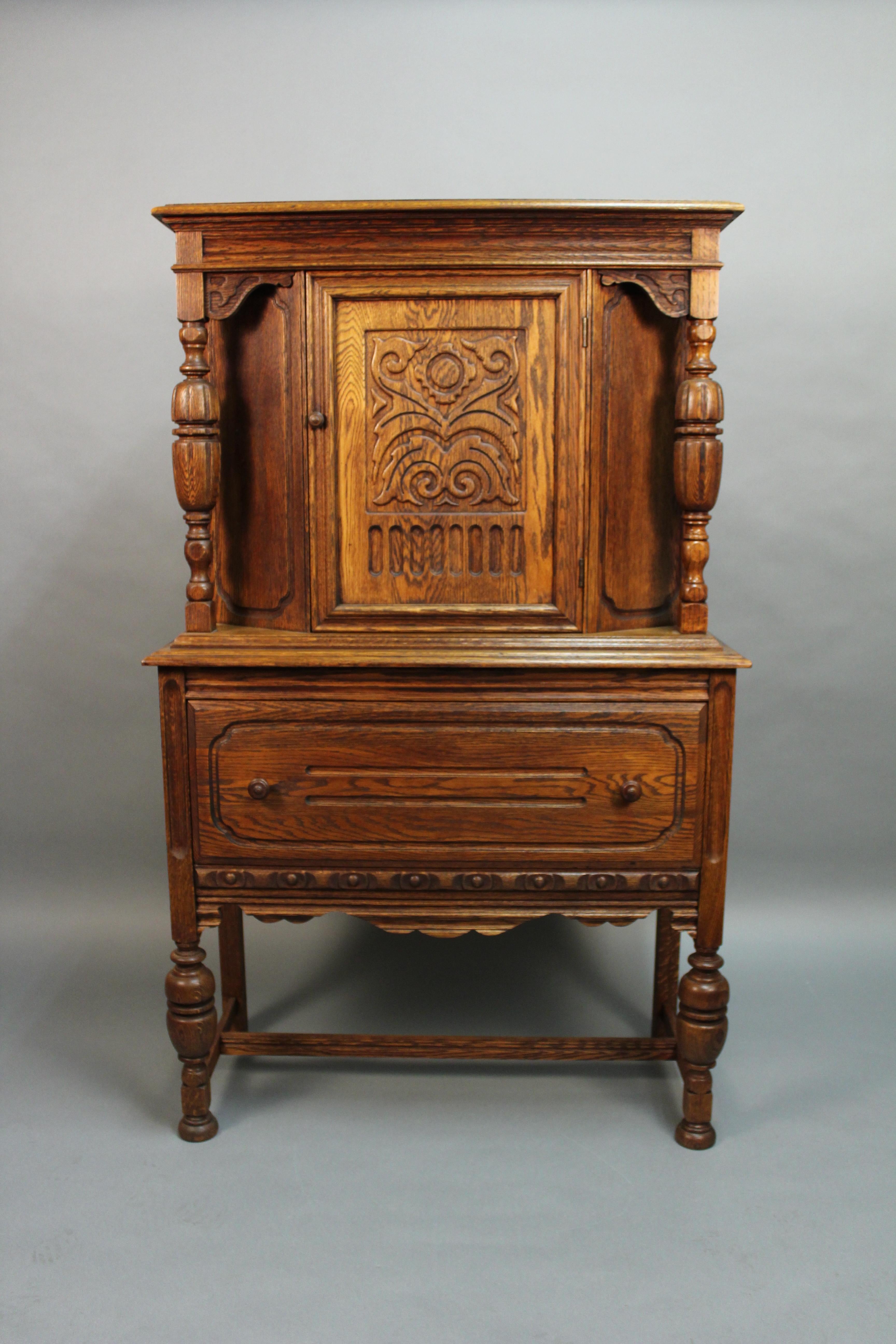 Carved Spanish Revival standing cabinet with nice storage. Measures: 62