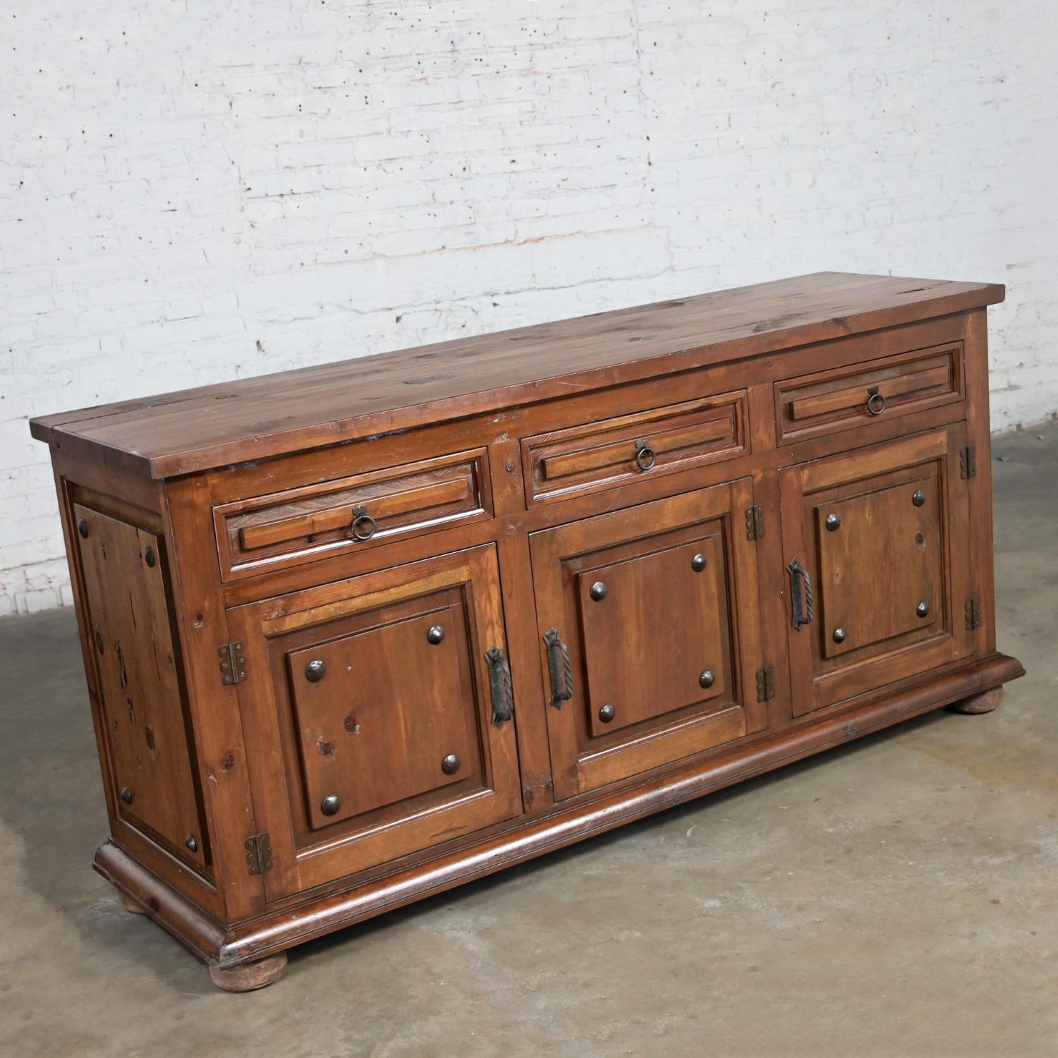 Handsome vintage Spanish Revival Rustic solid pine sideboard in the style of Artes De Mexico Internationales SA. Beautiful condition, keeping in mind that this is vintage and not new so will have signs of use and wear even if it has been refinished