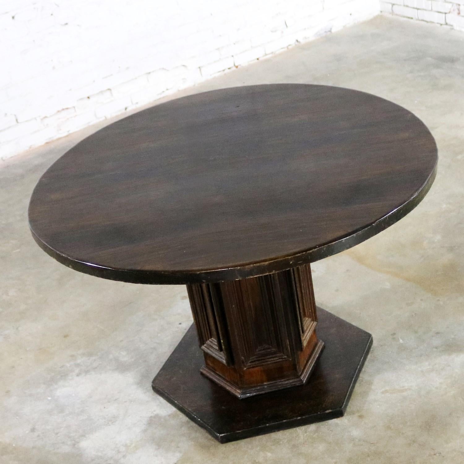 Handsome single pedestal round Spanish Colonial or Spanish Revival style dining table. In the style of and most likely by Artes De Mexico Internacionales, SA. There are two available but priced separately and they are both in wonderful vintage