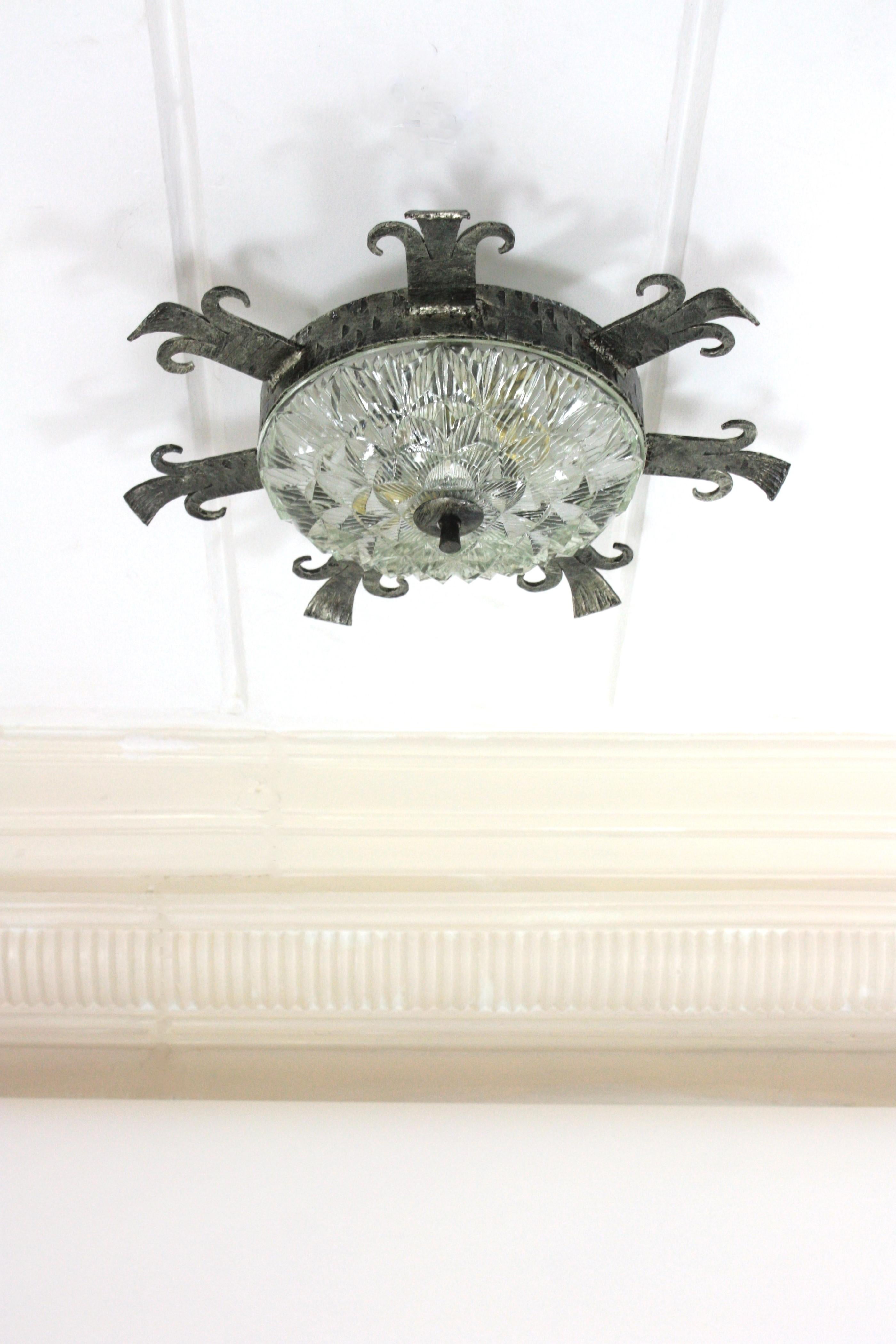 Brutalist 1940s Spanish Revival Sunburst Ceiling Light Fixture in Wrought Iron and Glass For Sale