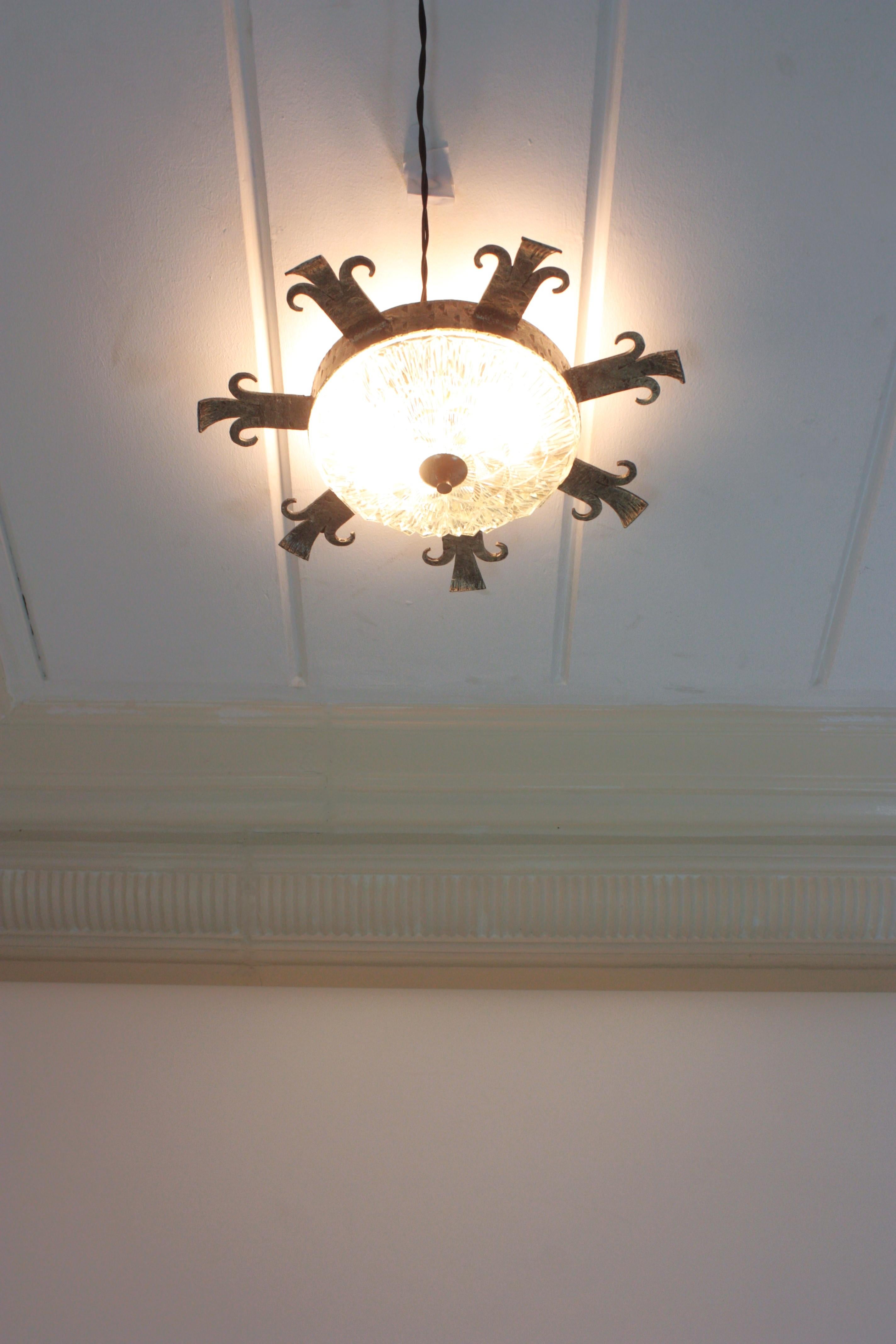 Forged 1940s Spanish Revival Sunburst Ceiling Light Fixture in Wrought Iron and Glass For Sale