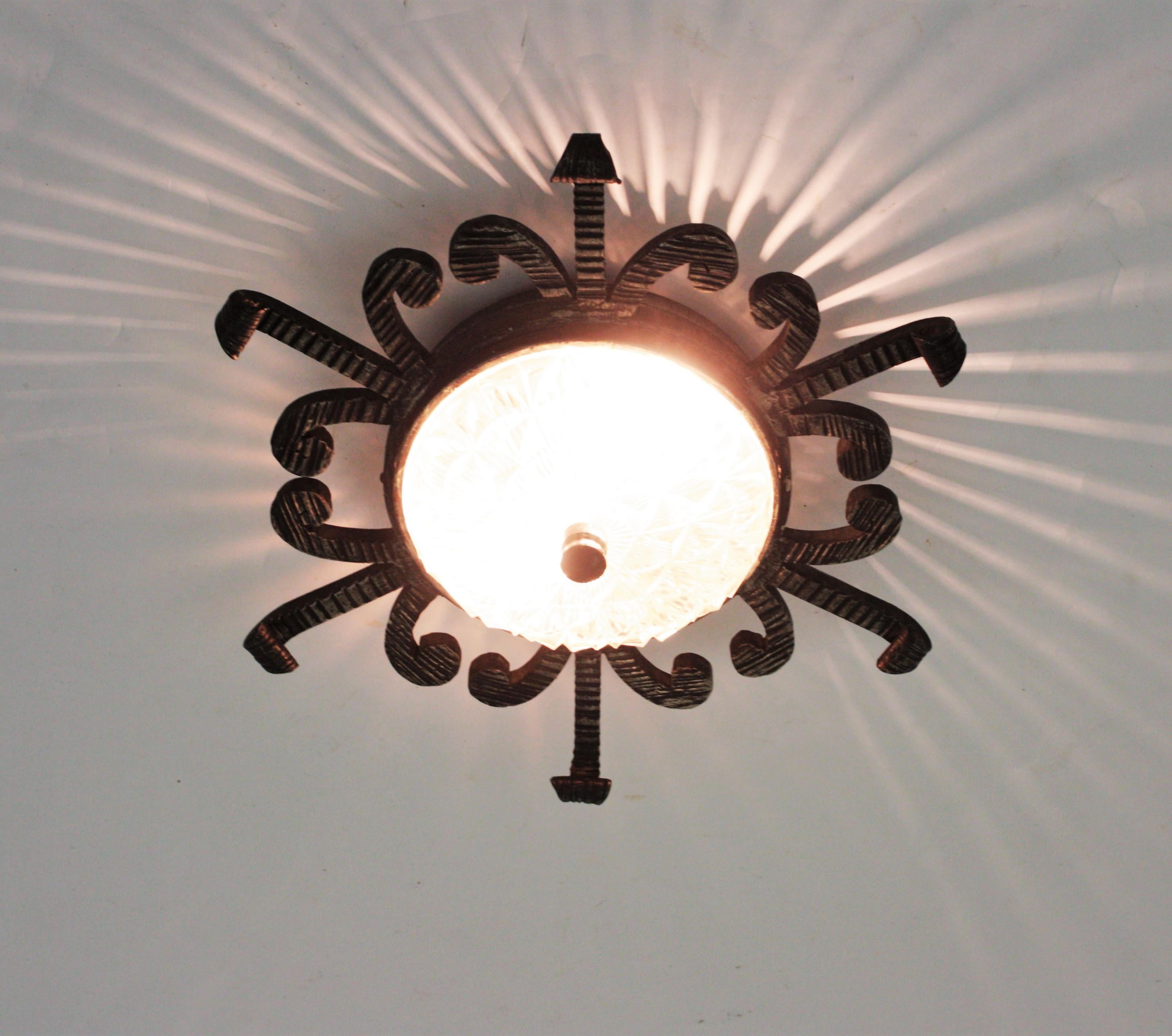 Spanish Revival Sunburst Iron and Glass Light Fixture, 1940s In Good Condition For Sale In Barcelona, ES