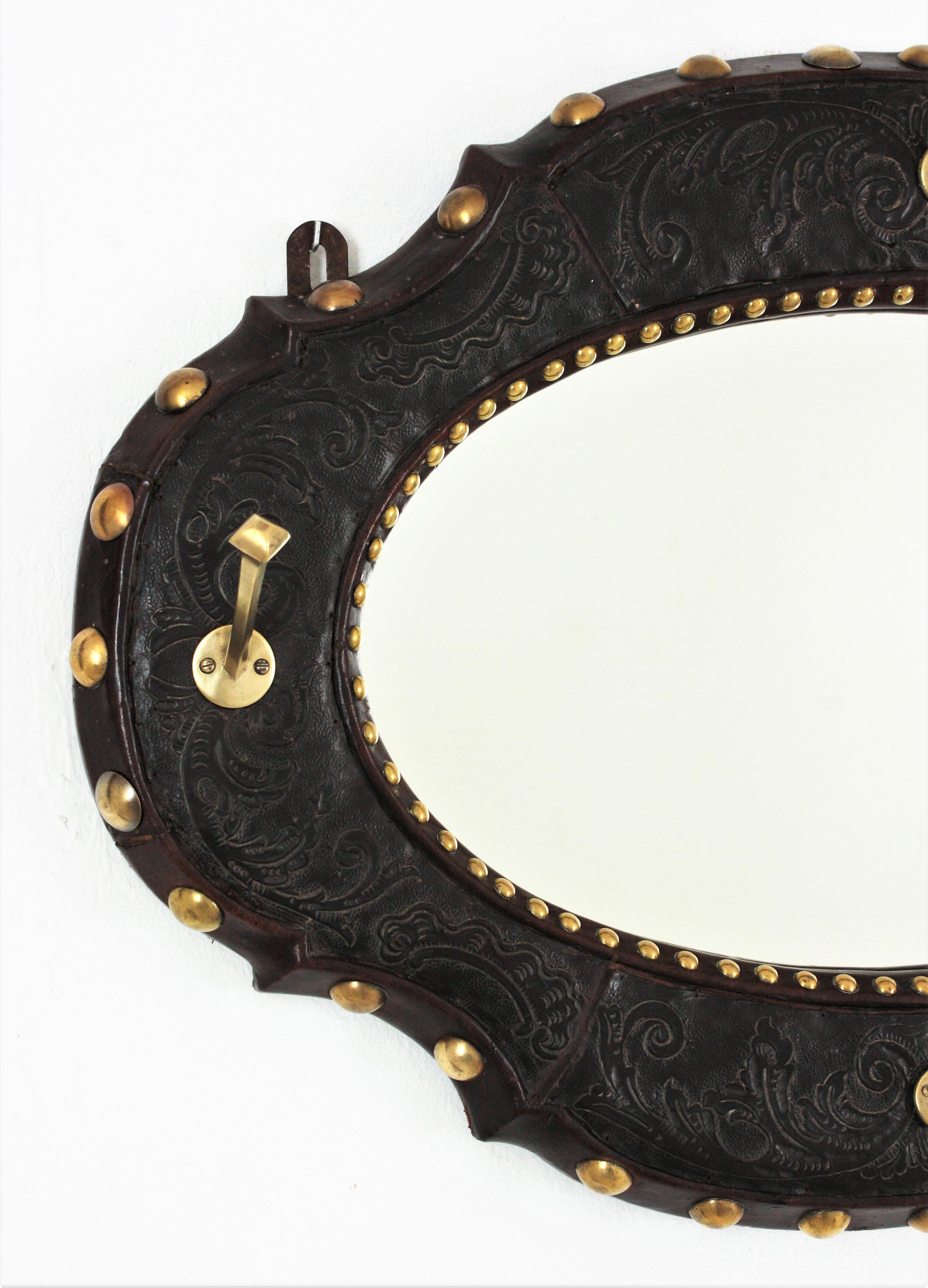 20th Century Spanish Revival Wall Mirror Coat Rack in Leather and Brass For Sale