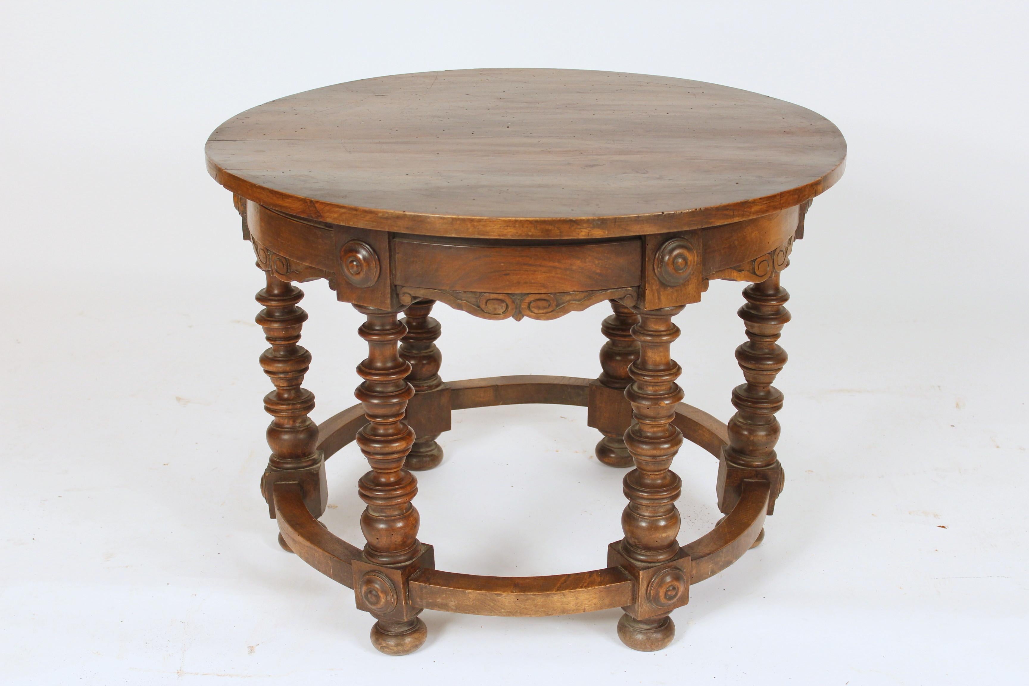 Spanish revival walnut occasional table with a round top and turned legs, circa 1920s.